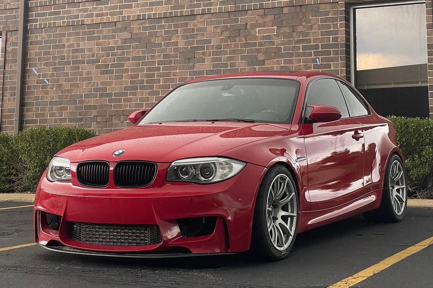 Red BMW E82 1M with 18" SM-10 Apex wheels in Race Silver