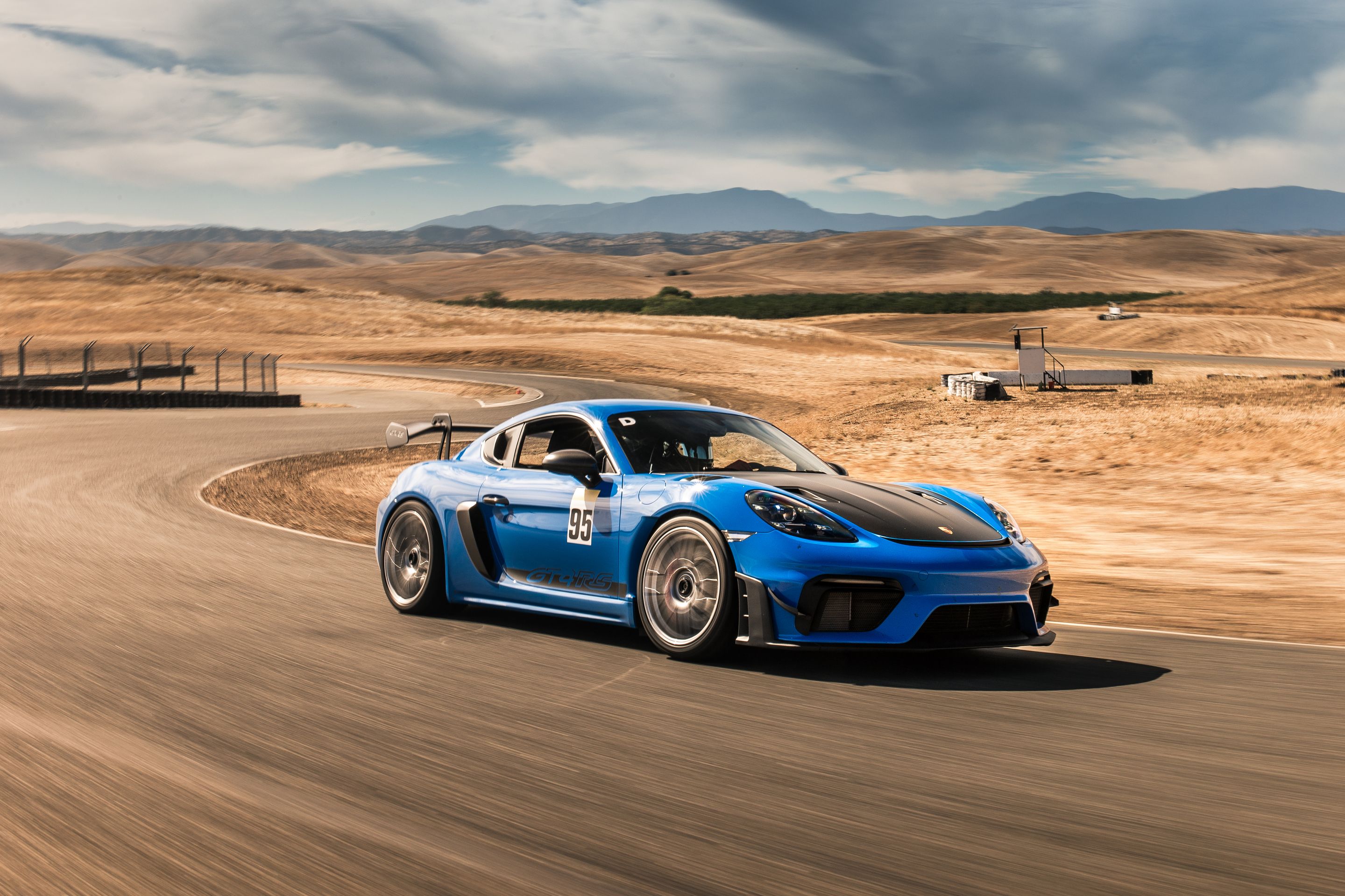 Blue Porsche 718 Cayman GT4 RS with 19" EC-7RS Apex wheels in Race Silver