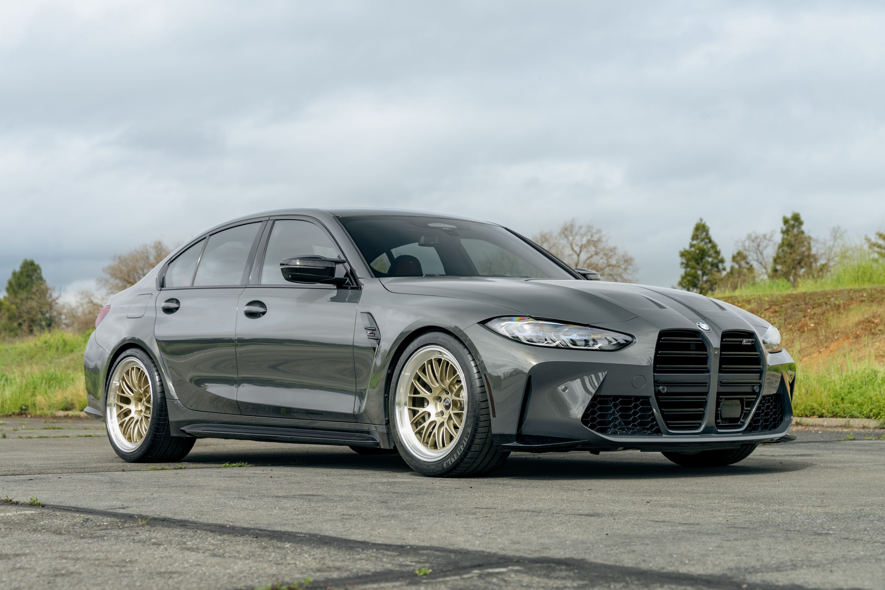 Grey BMW G80 M3 with 19"/20" ML-10RT Apex wheels in Machined Lip Gloss Motorsport Gold