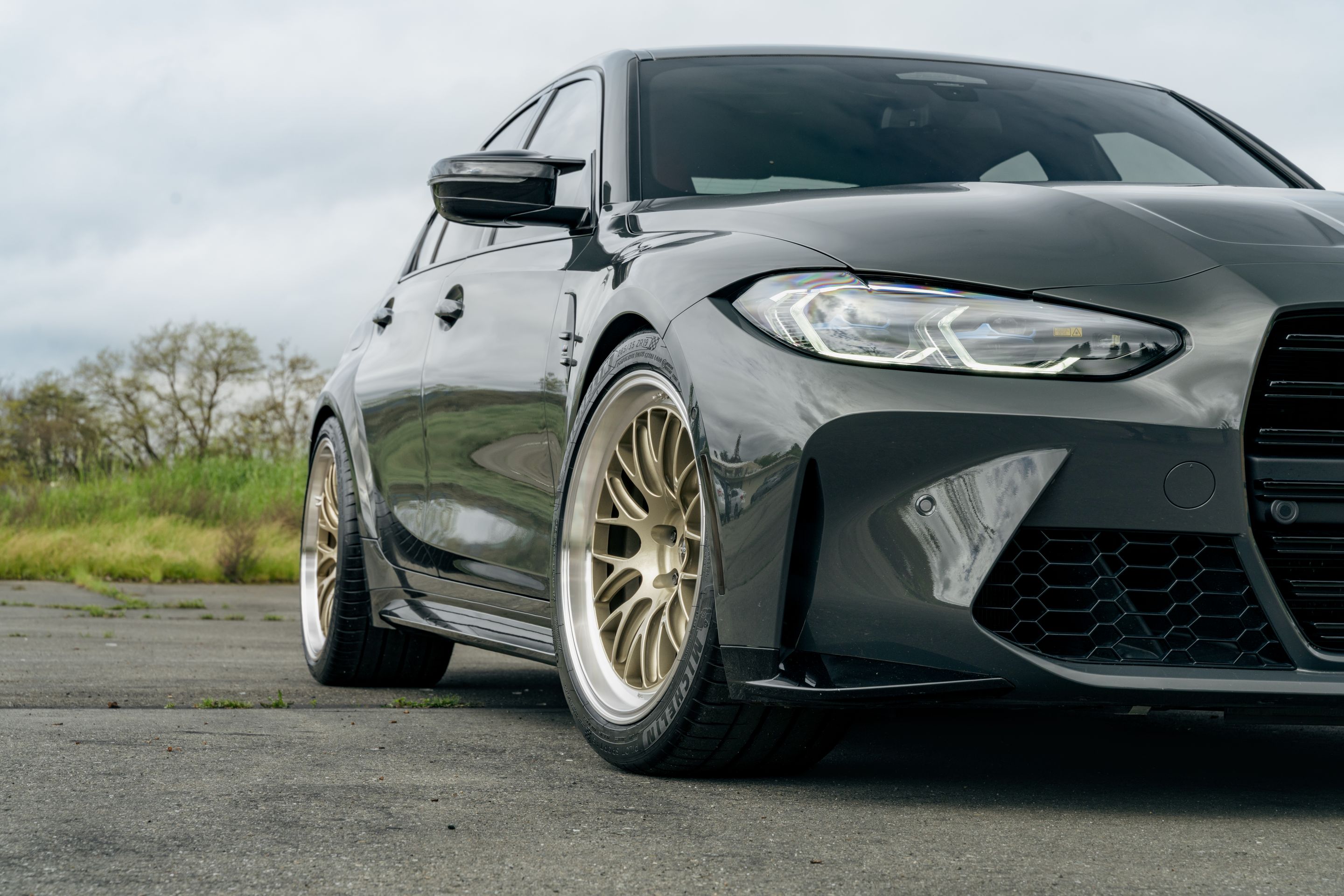 Grey BMW G80 M3 with 19"/20" ML-10RT Apex wheels in Machined Lip Gloss Motorsport Gold