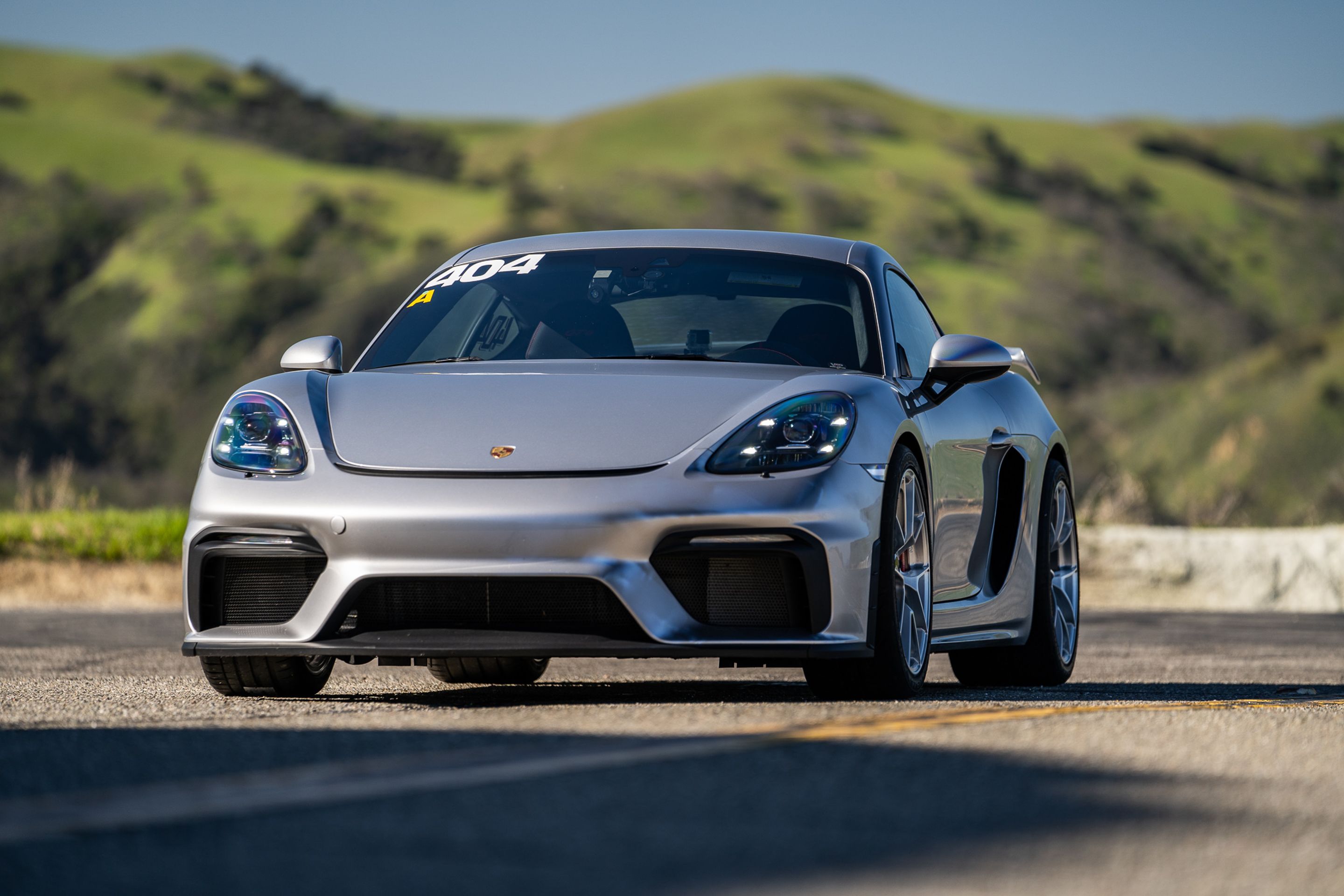 Grey Porsche 718 Cayman GT4 with 19" VS-5RS Apex wheels in Brushed Clear