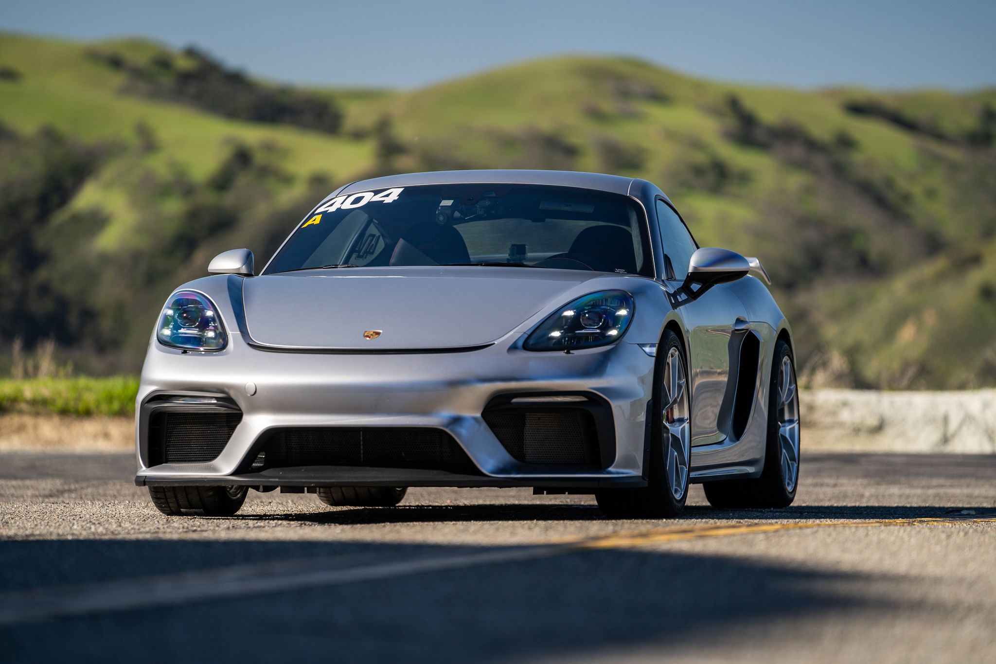 Grey Porsche 718 Cayman GT4 with 19" VS-5RS Apex wheels in Brushed Clear