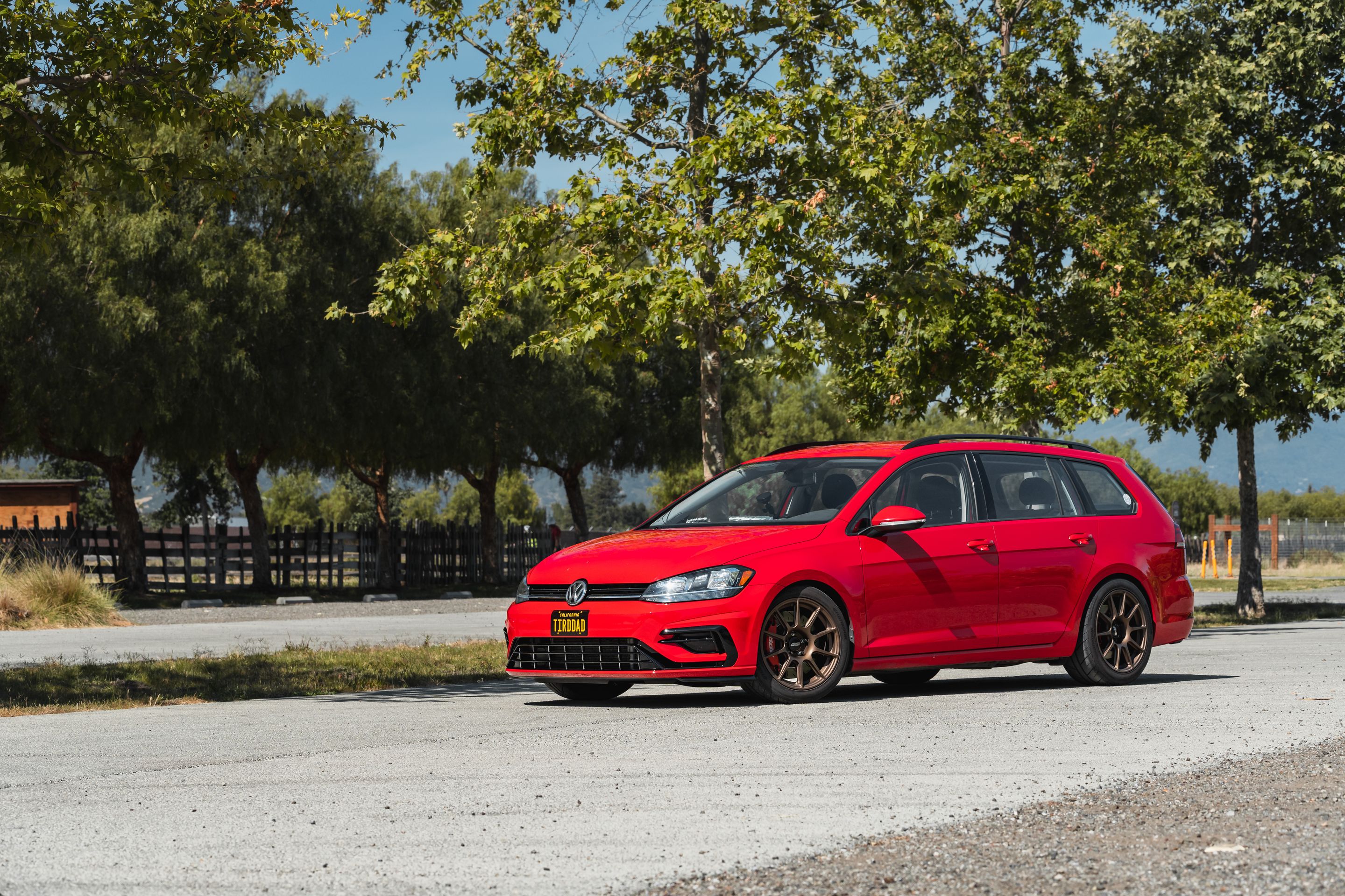 Red VW MK7 Alltrack/SportWagen Golf SportWagen with 17" SM-10 Apex wheels in Satin Bronze