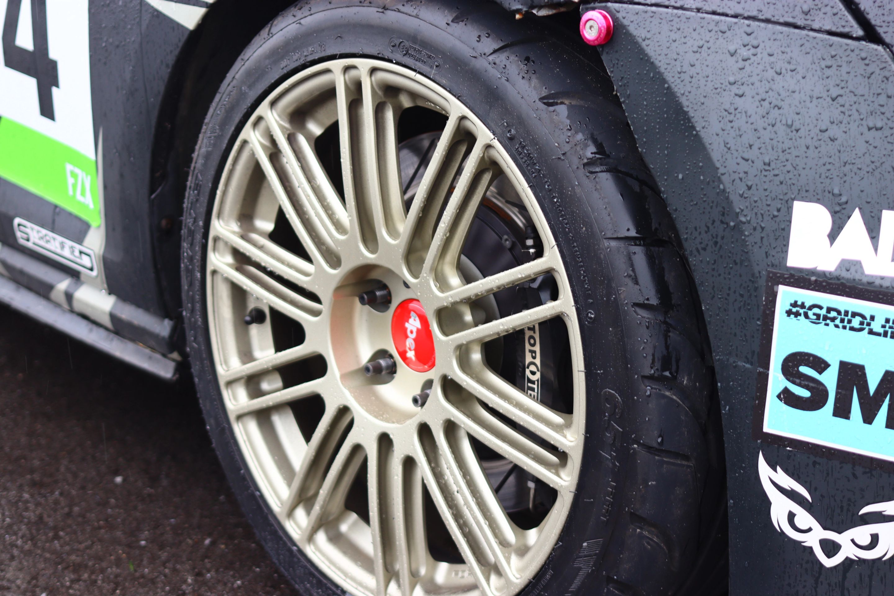 Race Livery VW MK7 GTI with 18" TC-10RT Apex wheels in Motorsport Gold