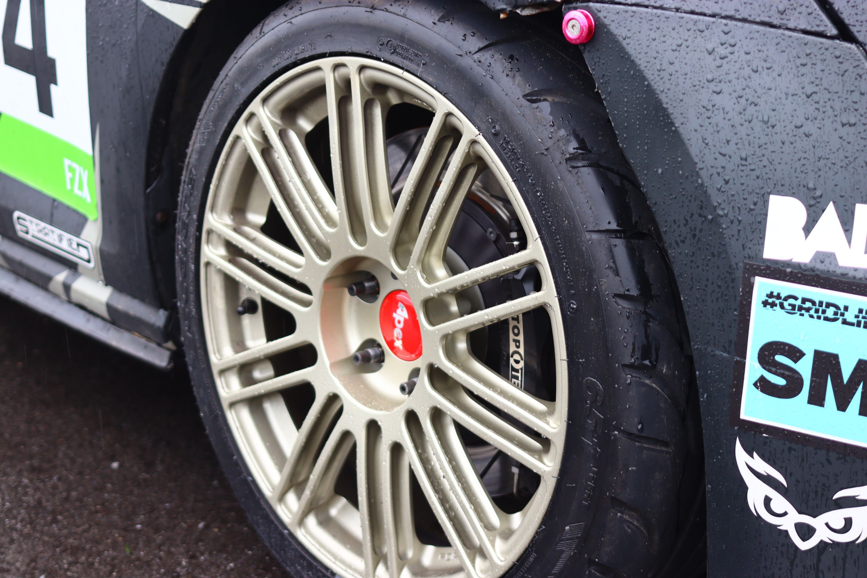 Race Livery VW MK7 GTI with 18" TC-10RT Apex wheels in Motorsport Gold