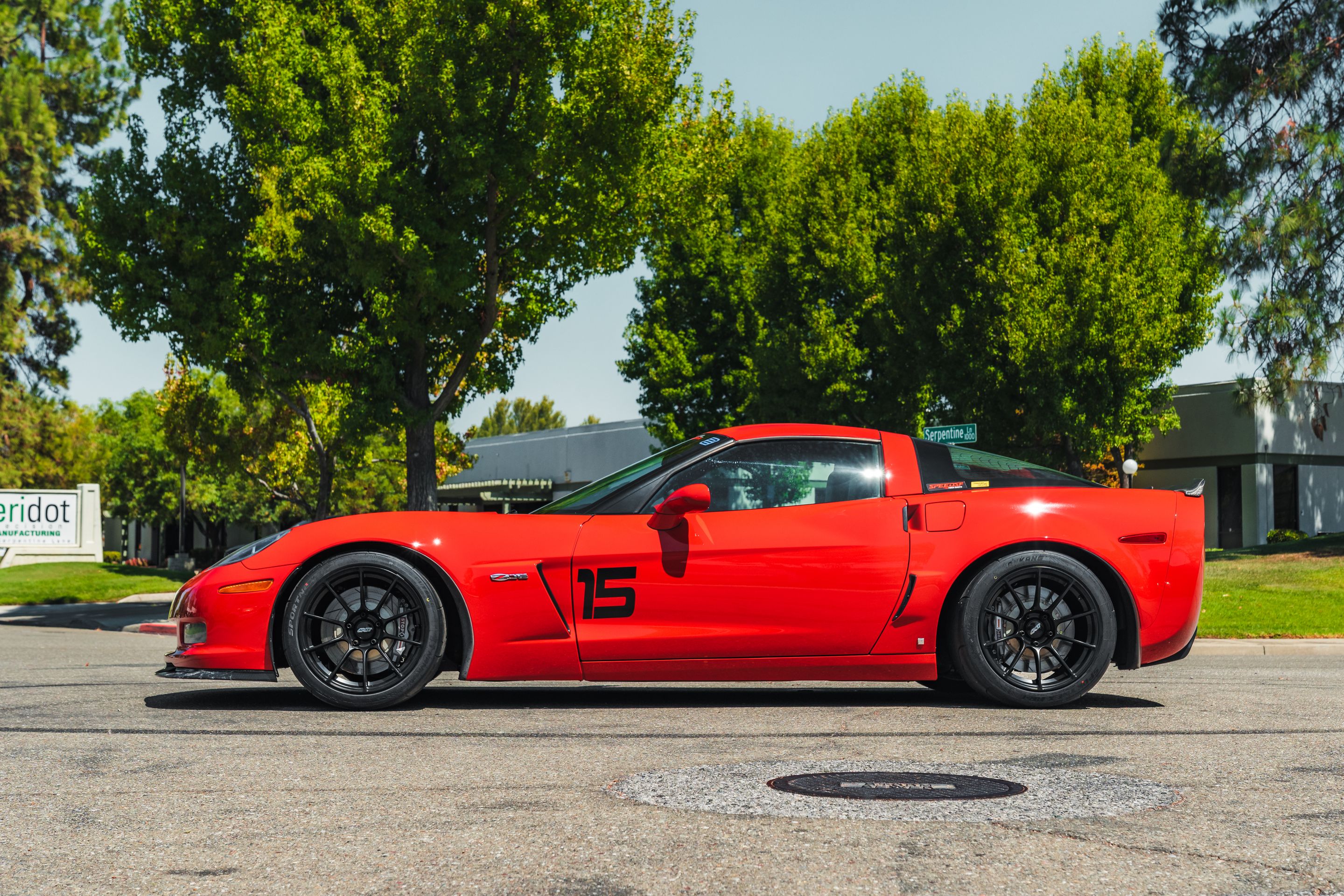 Red Chevrolet C6 Corvette Z06 with 18" SM-10RS Apex wheels in Satin Black