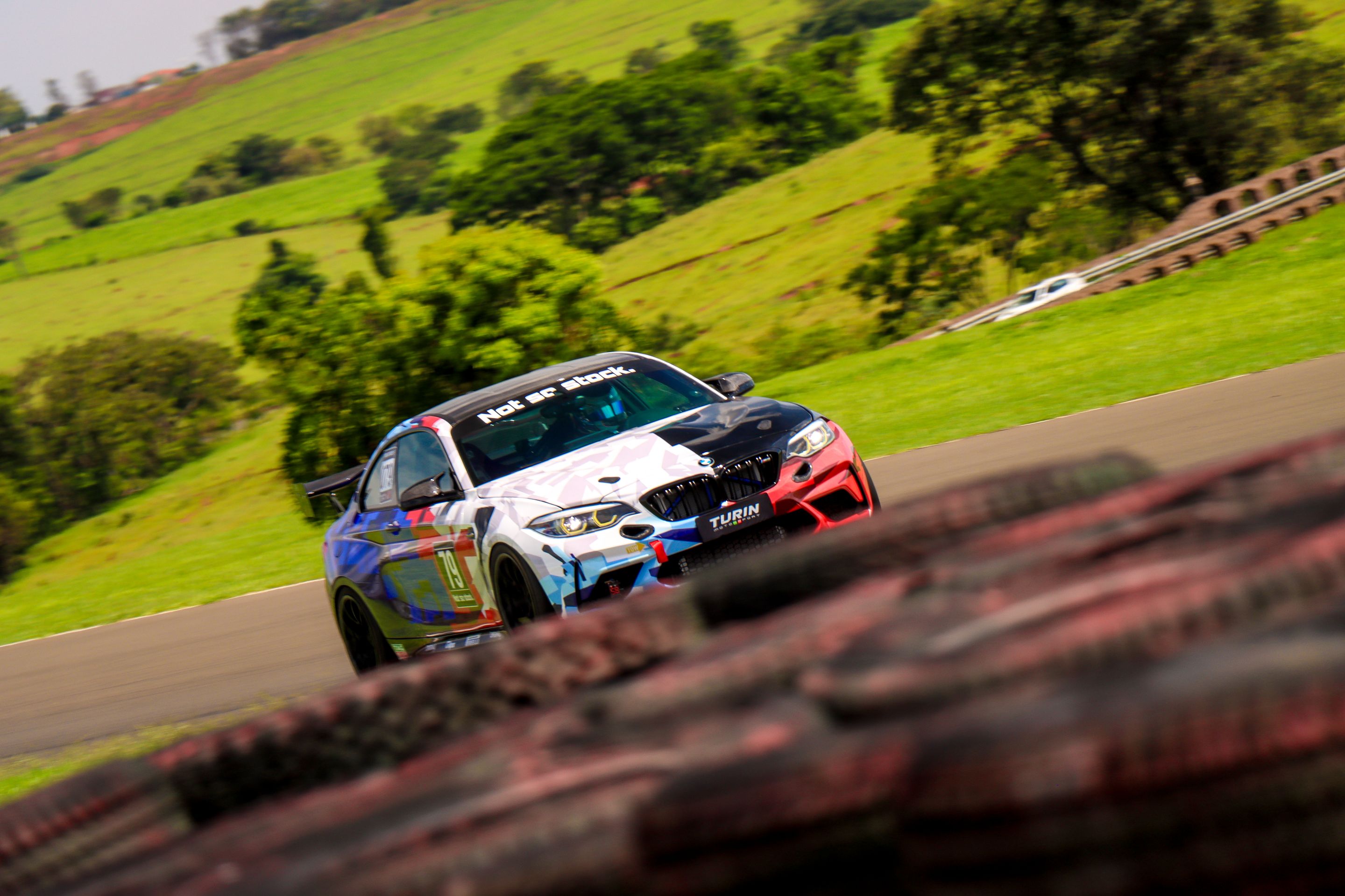 Multicolor BMW F87 M2 with 18" EC-7 Apex wheels in Satin Black