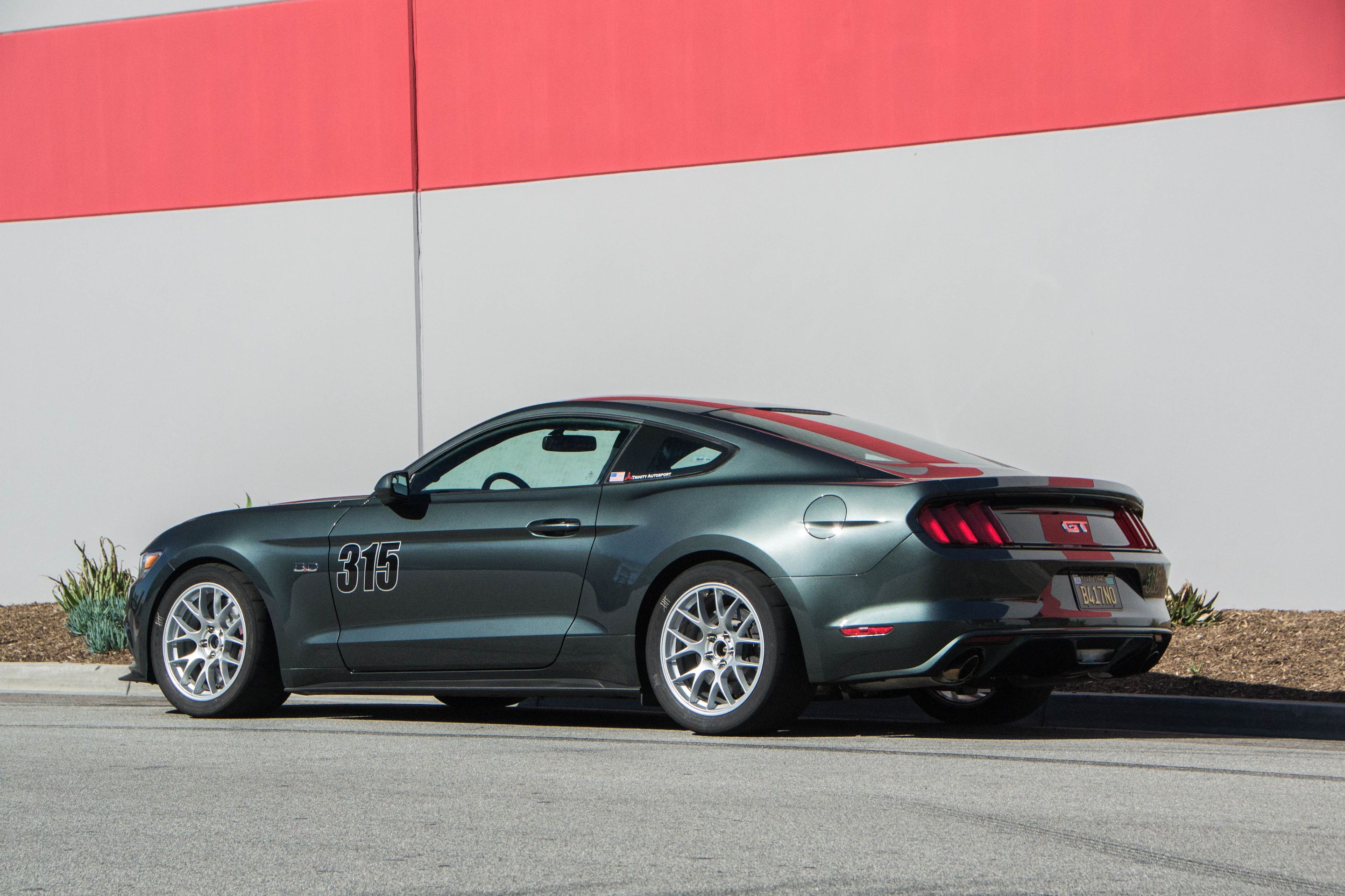 Green Ford S550 Mustang GT with 18" EC-7 Apex wheels in Race Silver