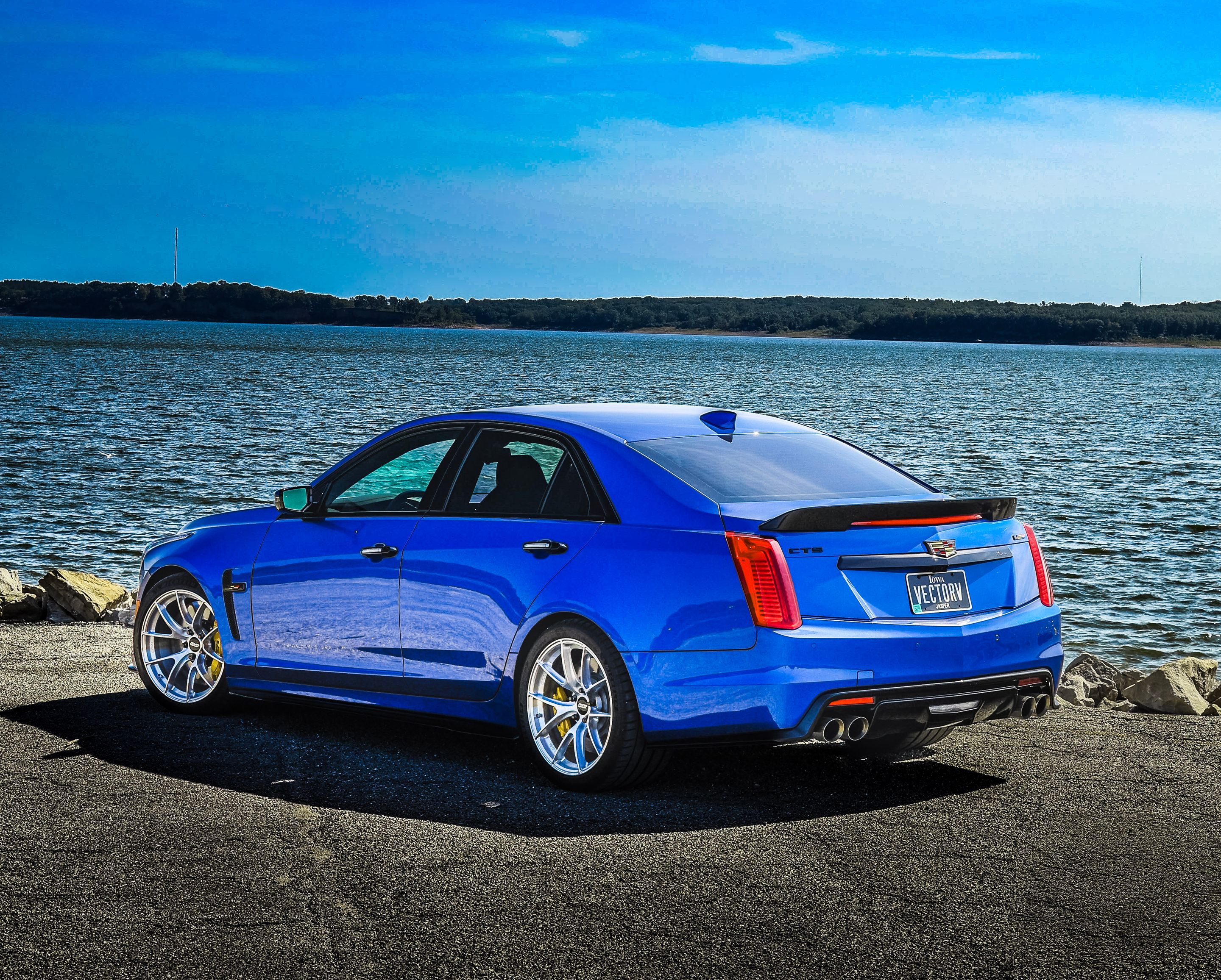 Blue Cadillac Gen 3 CTS-V with 19" VS-5RS Apex wheels in Brushed Clear