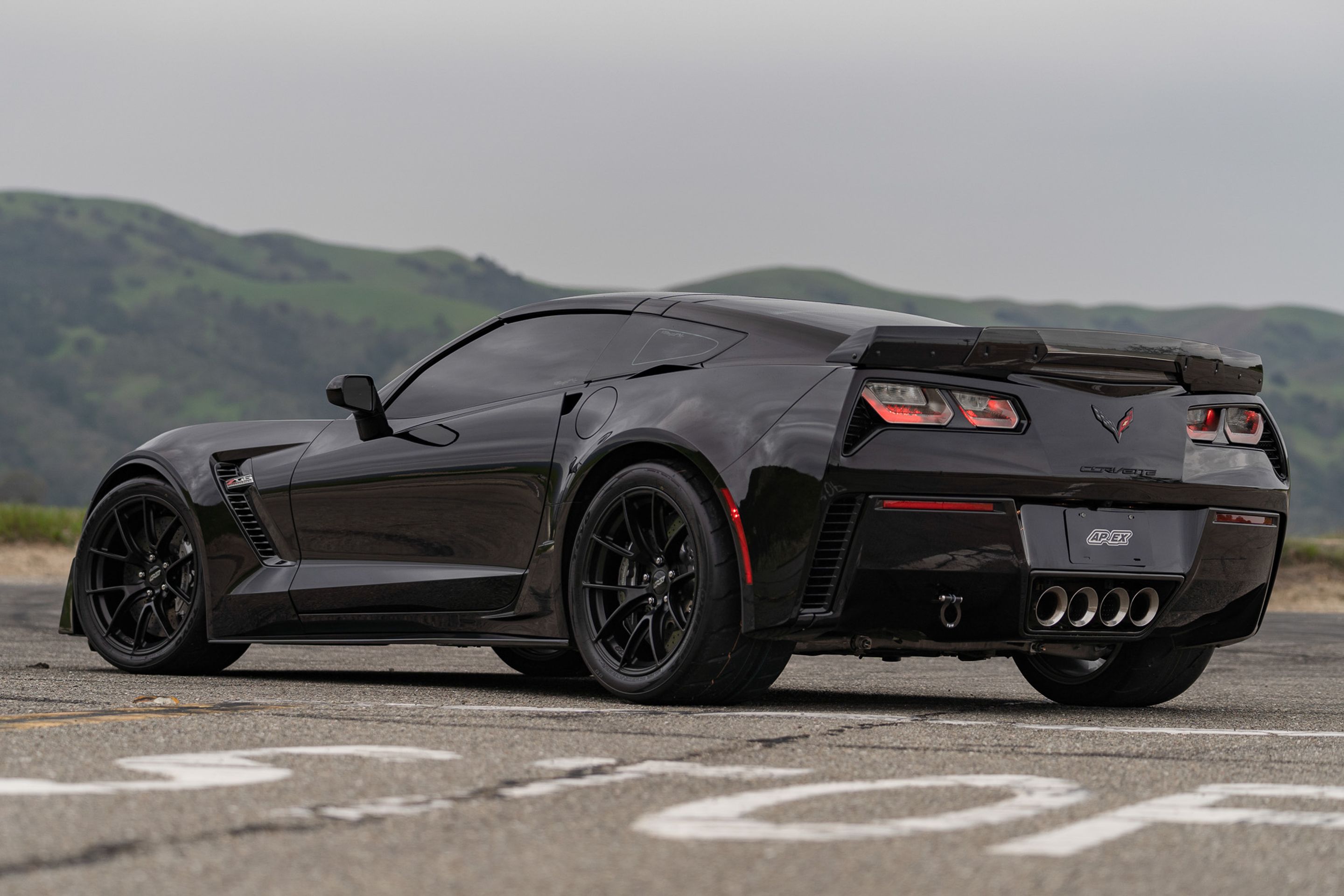 Black Chevrolet C7 Corvette Z06 with 19" VS-5RS Apex wheels in Satin Black