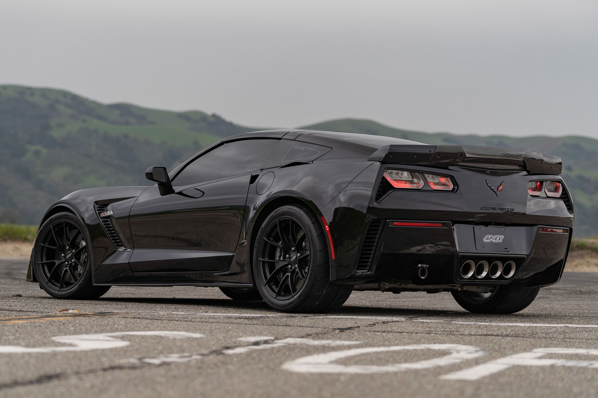 Black Chevrolet C7 Corvette Z06 with 19" VS-5RS Apex wheels in Satin Black