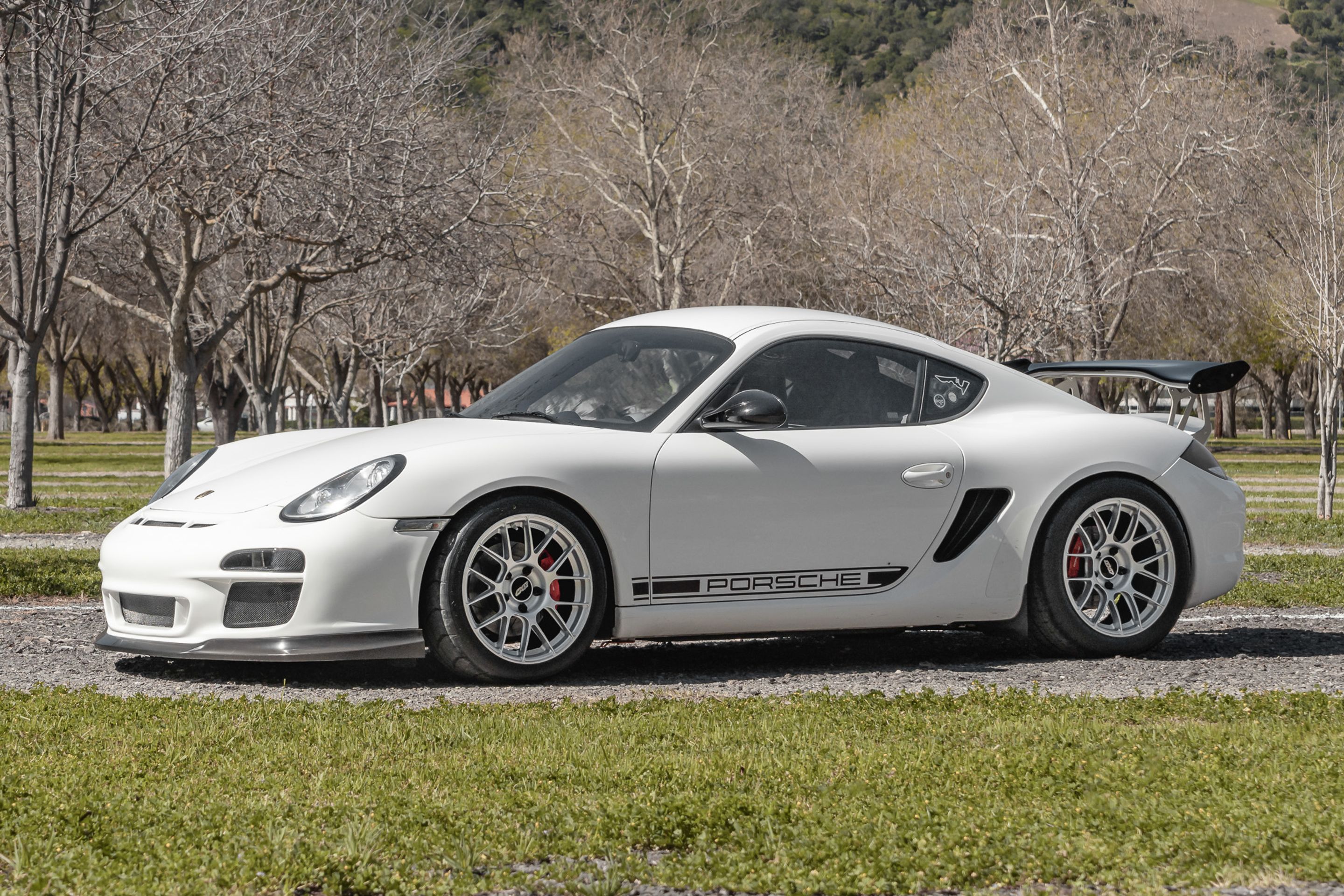 White Porsche 987 Cayman R with 18" EC-7RS Apex wheels in Race Silver
