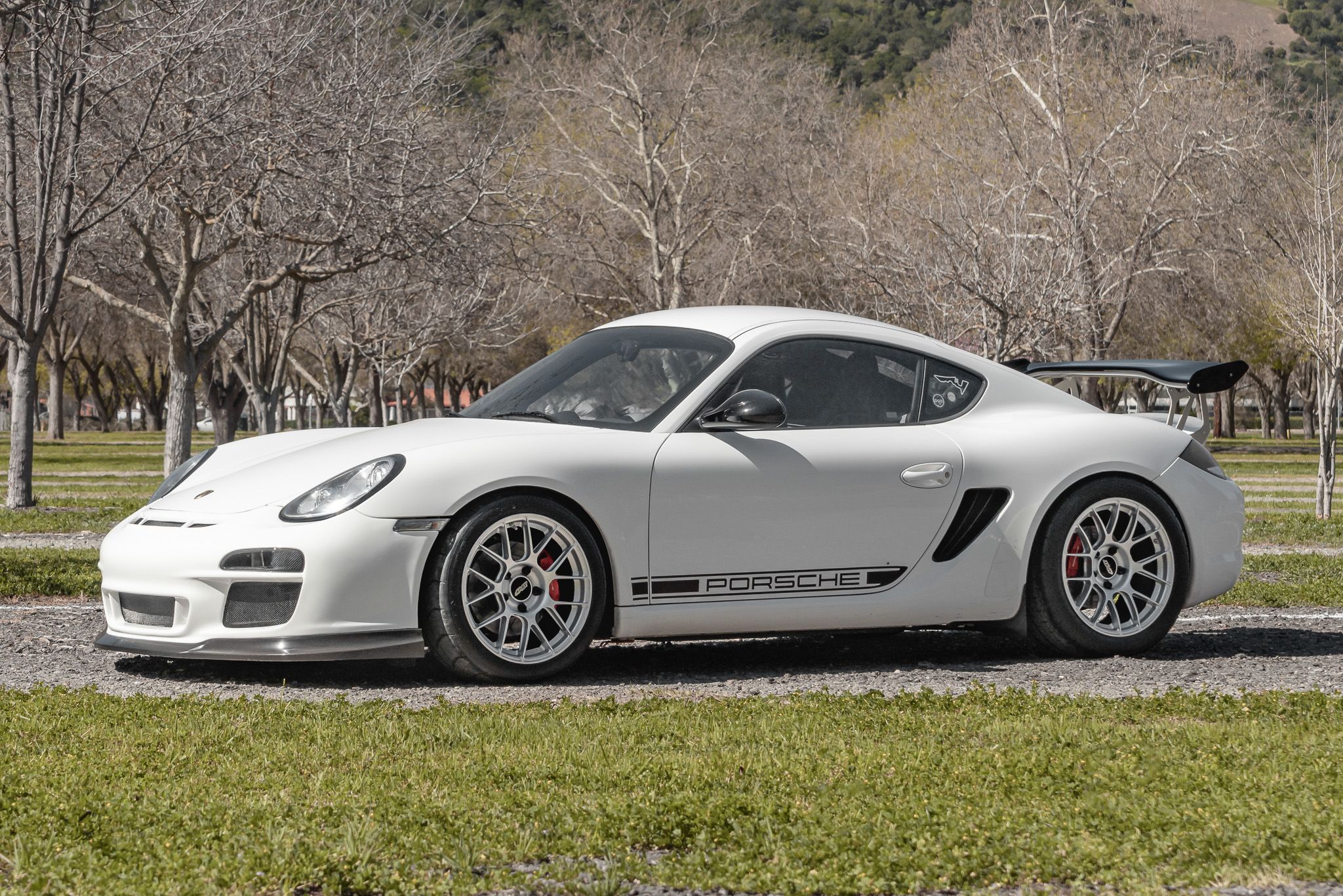White Porsche 987 Cayman R with 18" EC-7RS Apex wheels in Race Silver