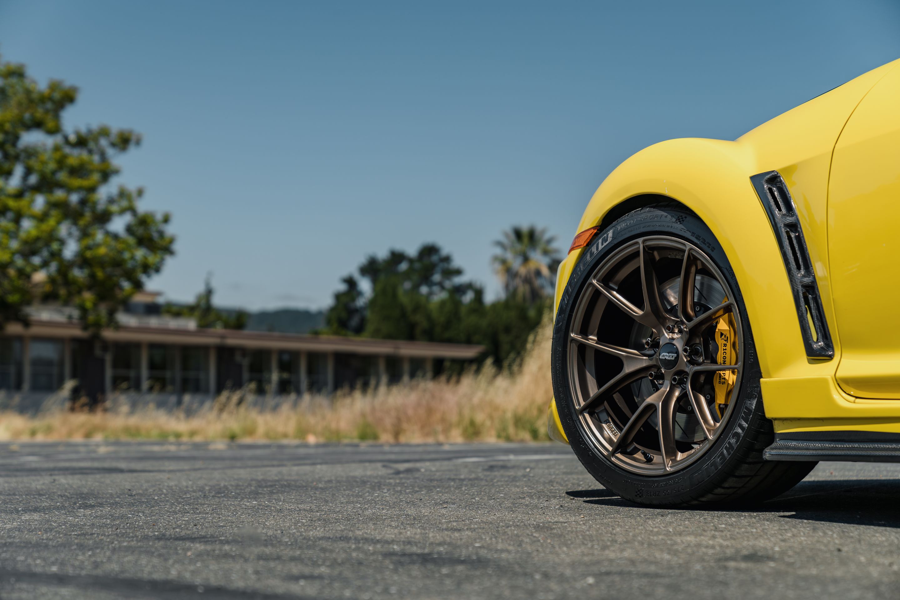 Yellow Mazda RX-8 with 18" VS-5RS Apex wheels in Satin Bronze