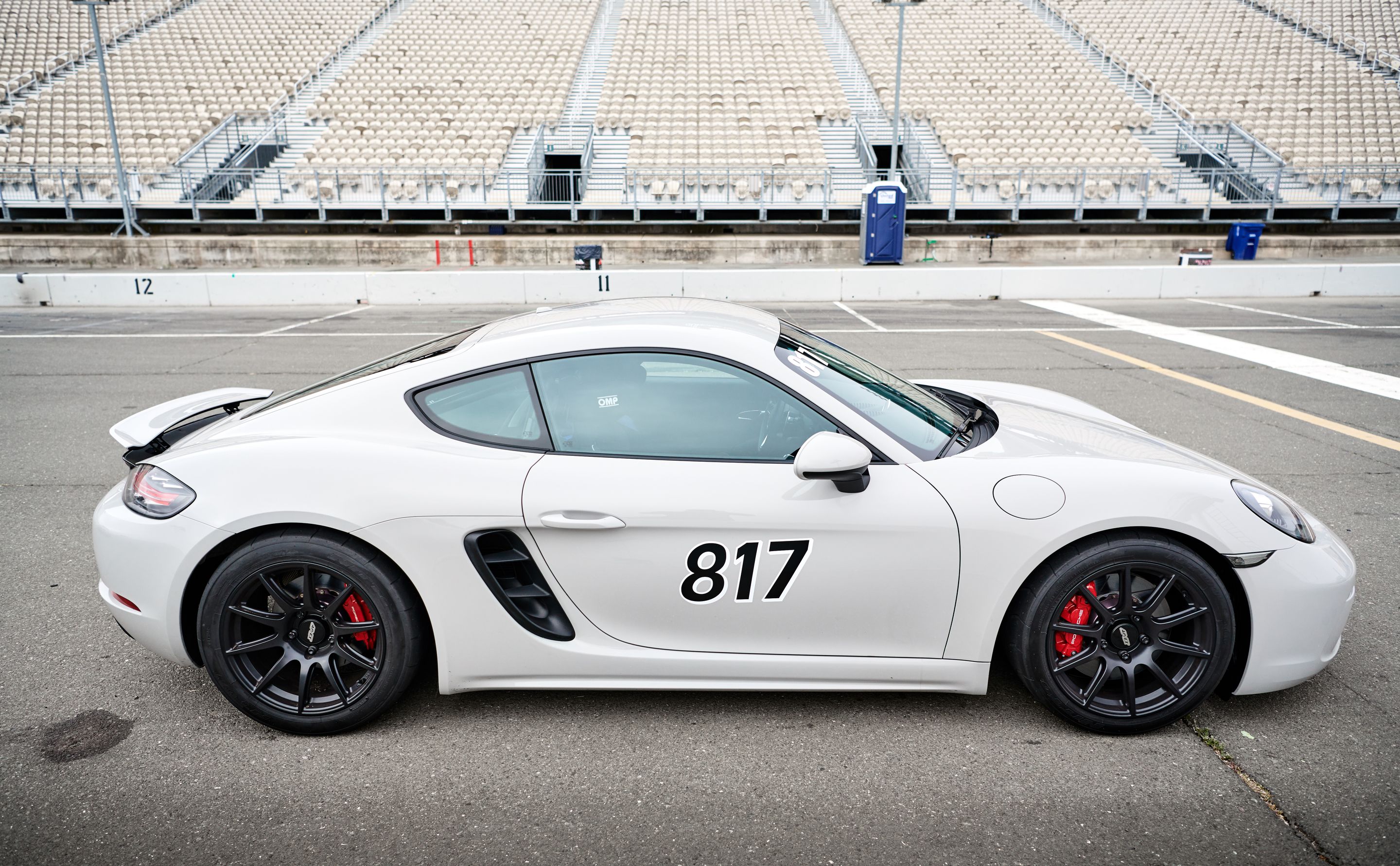 White Porsche 718 Cayman S with 18" SM-10 Apex wheels in Satin Black