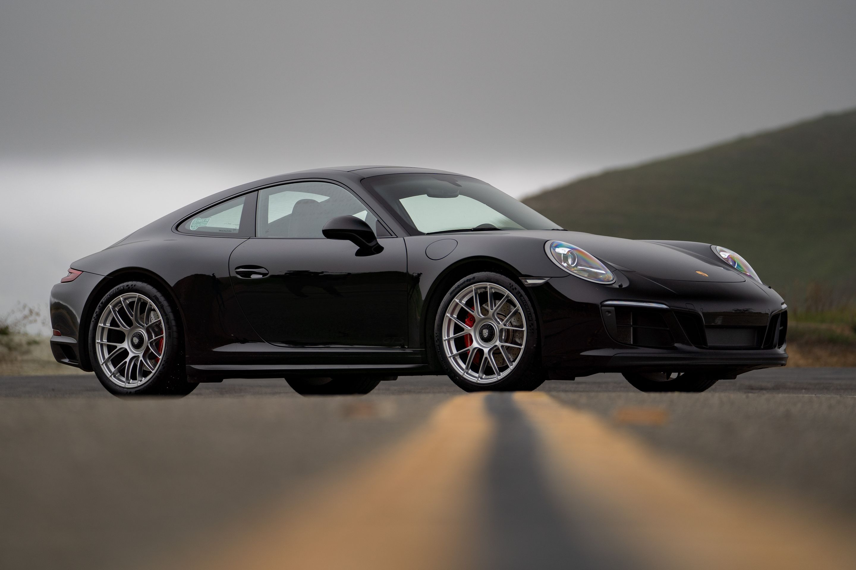 Black Porsche 911 991.2 Carrera GTS with 19" EC-7RS Apex wheels in Race Silver