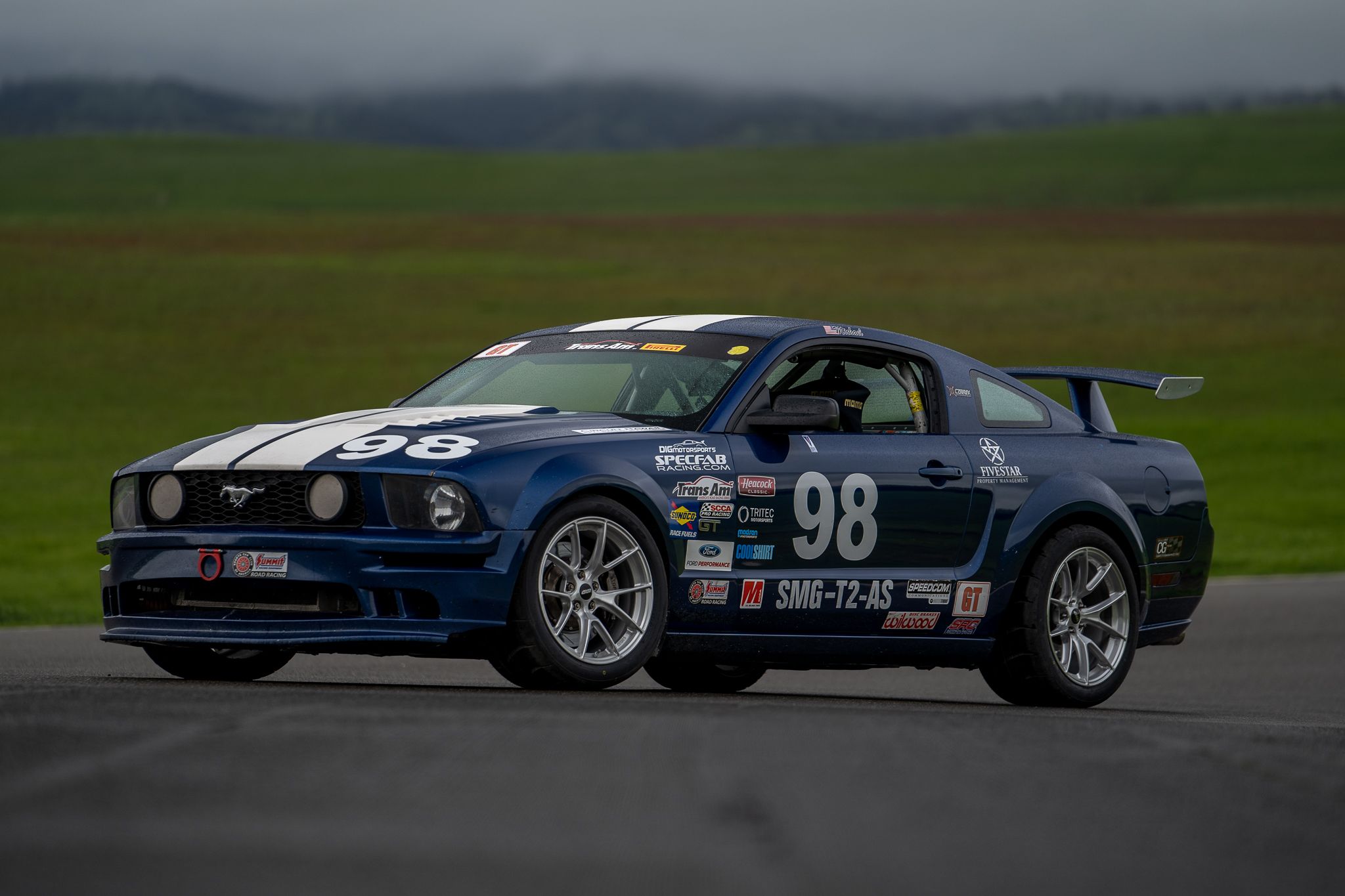 Blue Ford S197 Mustang GT with 18" VS-5RS Apex wheels in Brushed Clear