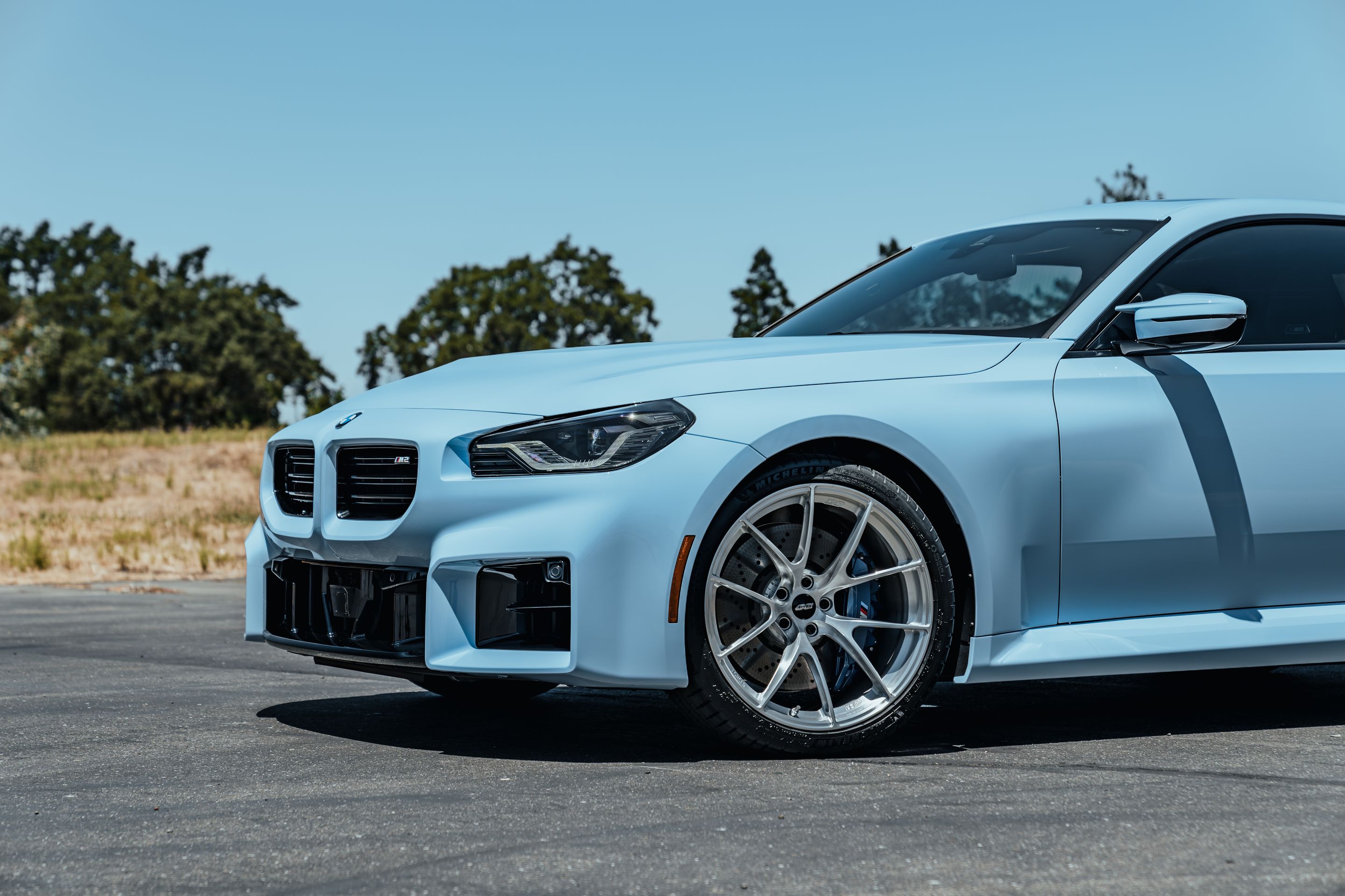Blue BMW G87 M2 with 20" VS-5RS Apex wheels in Brushed Clear