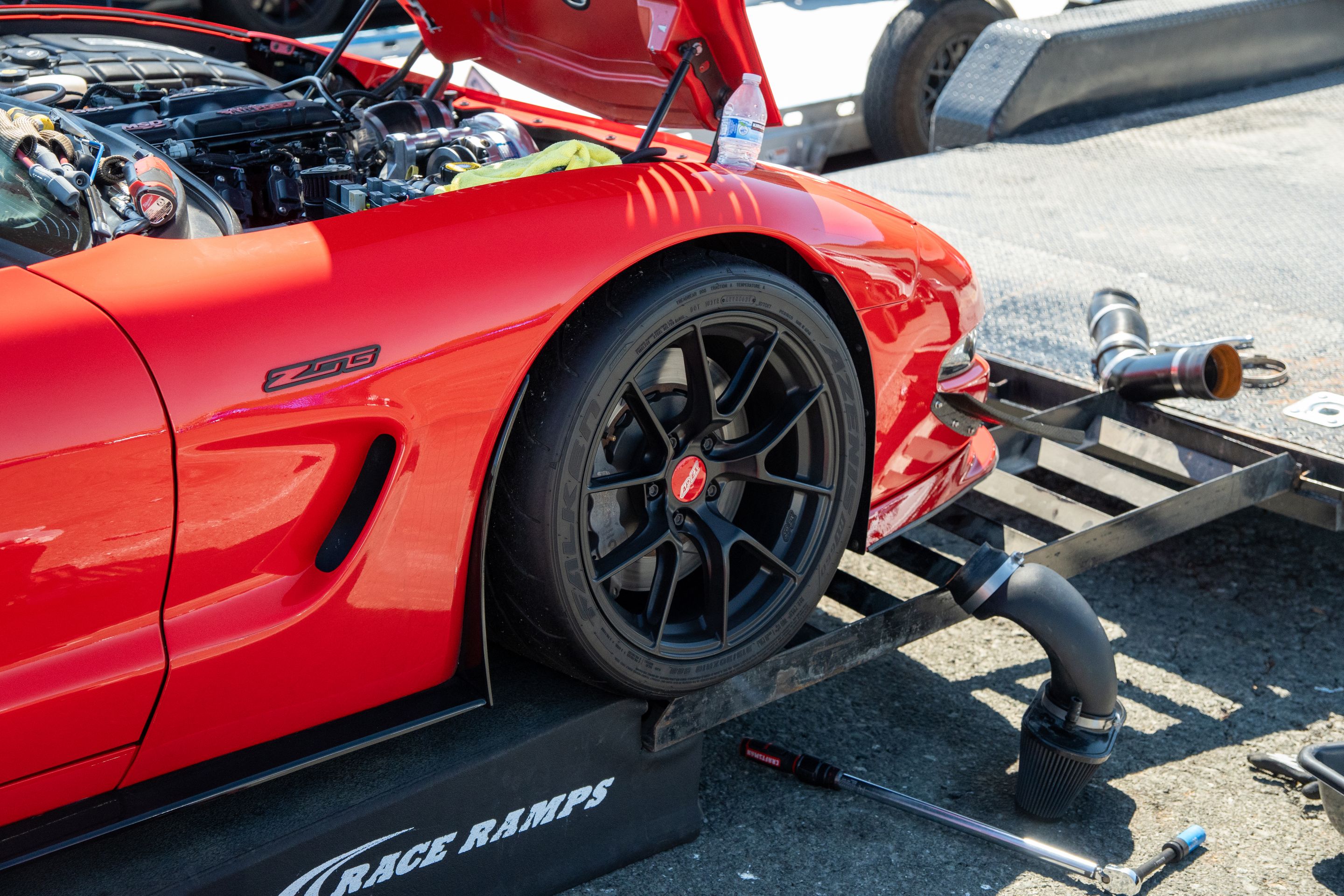 Red Chevrolet C5 Corvette Z06 with 18" VS-5RS Apex wheels in Satin Black