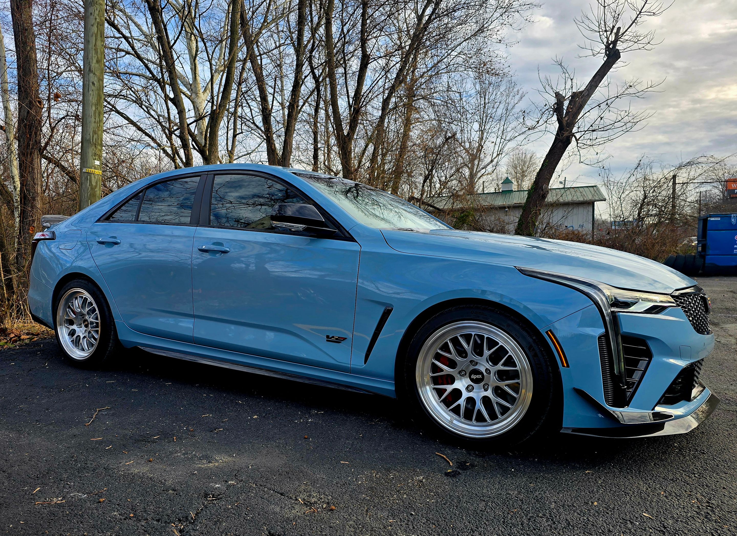 Blue Cadillac CT4-V Blackwing with 18" ML-10RT Apex wheels in Brushed Clear