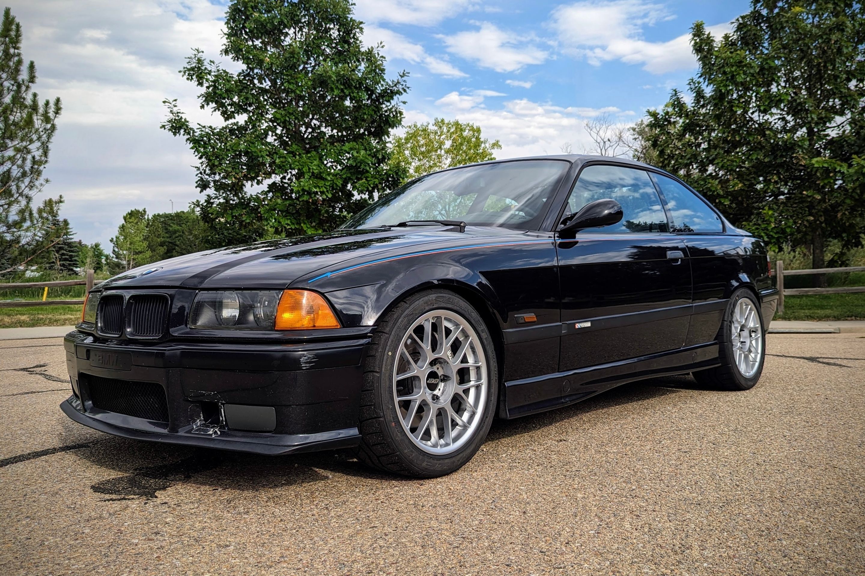 Black BMW E36 M3 with 17" ARC-8 Apex wheels in Hyper Silver
