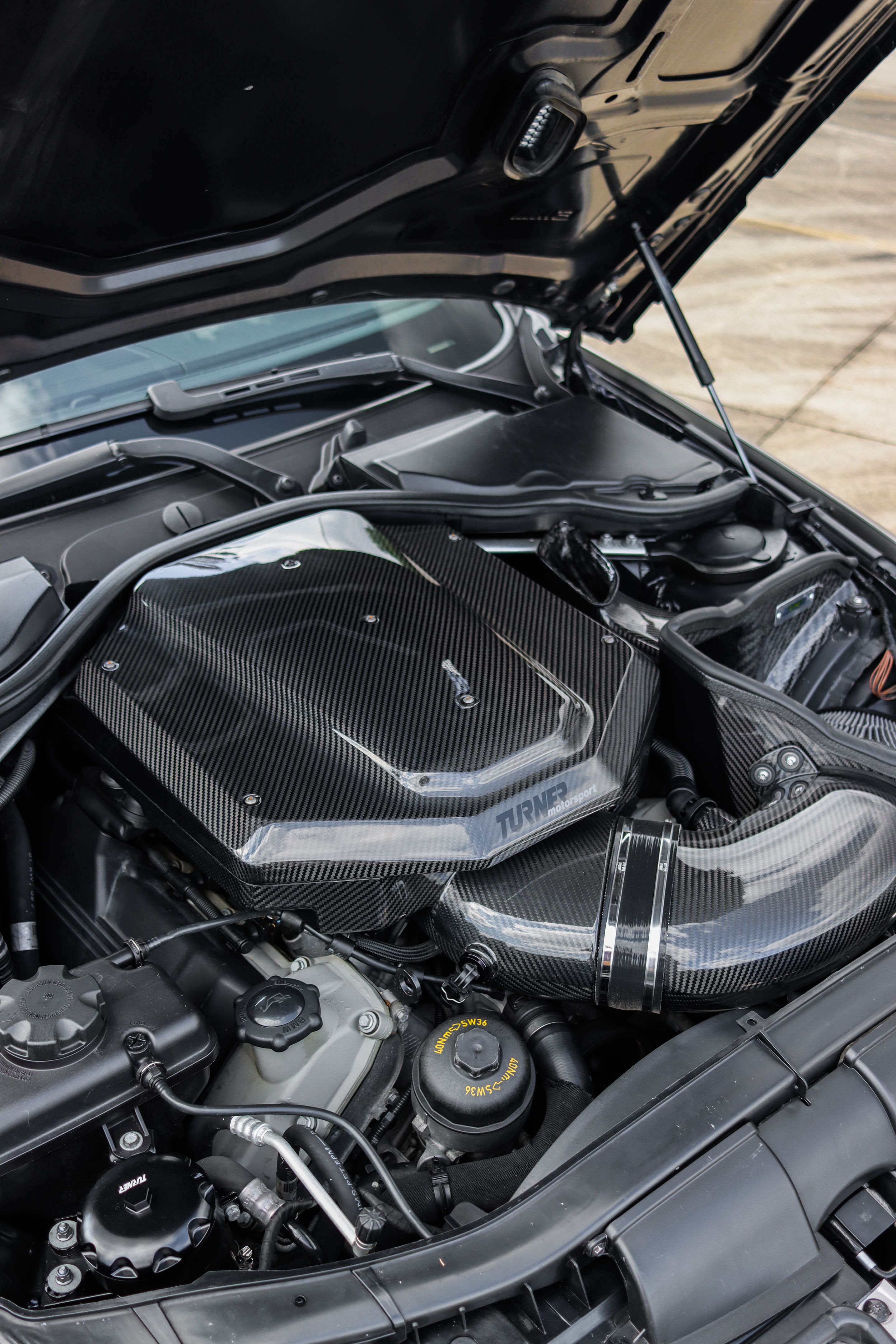 Black BMW E82 1M with 18" VS-5RS Apex wheels in Satin Black