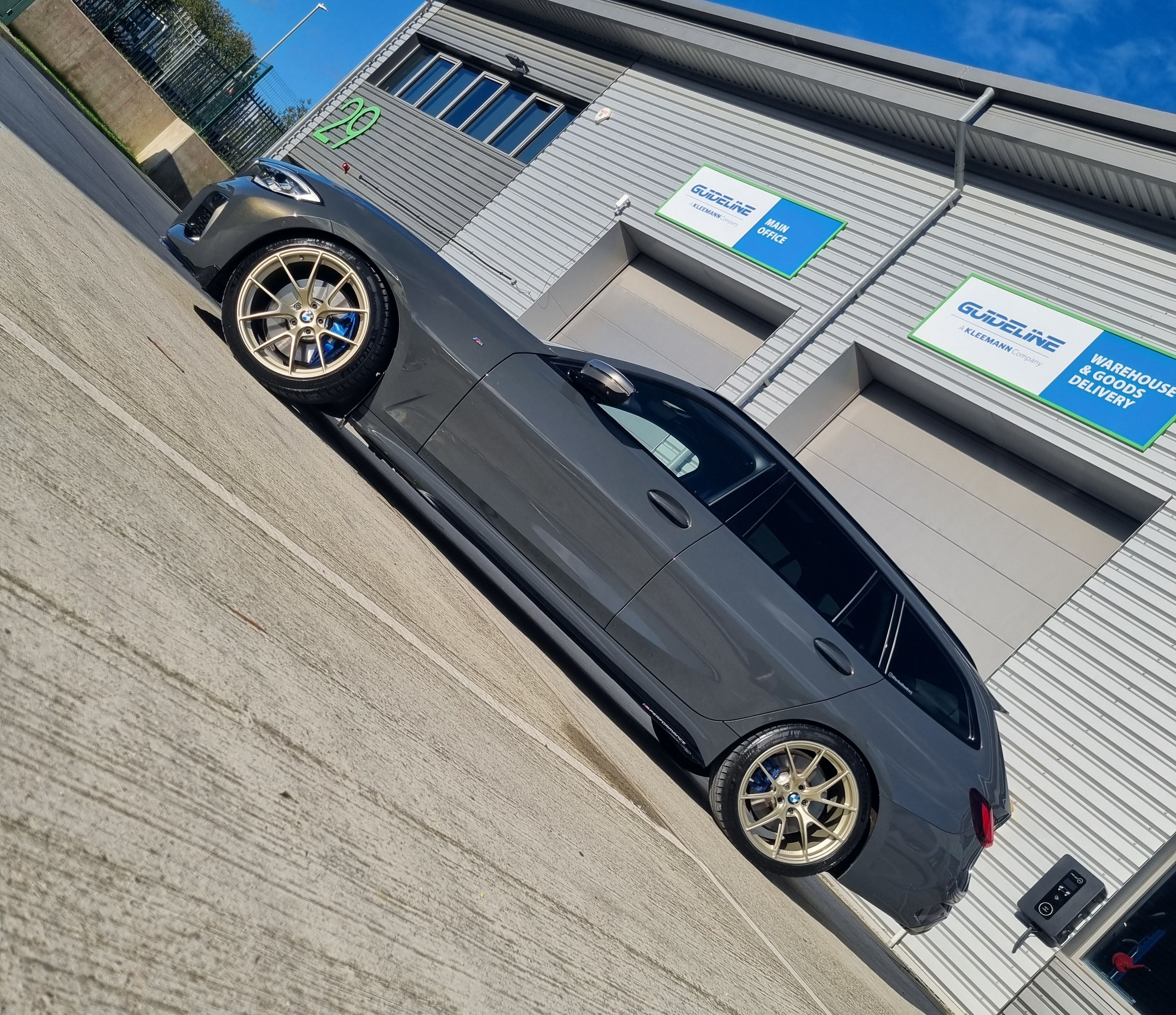 Black BMW G21 Wagon 3 Series with 19" VS-5RS Apex wheels in Motorsport Gold