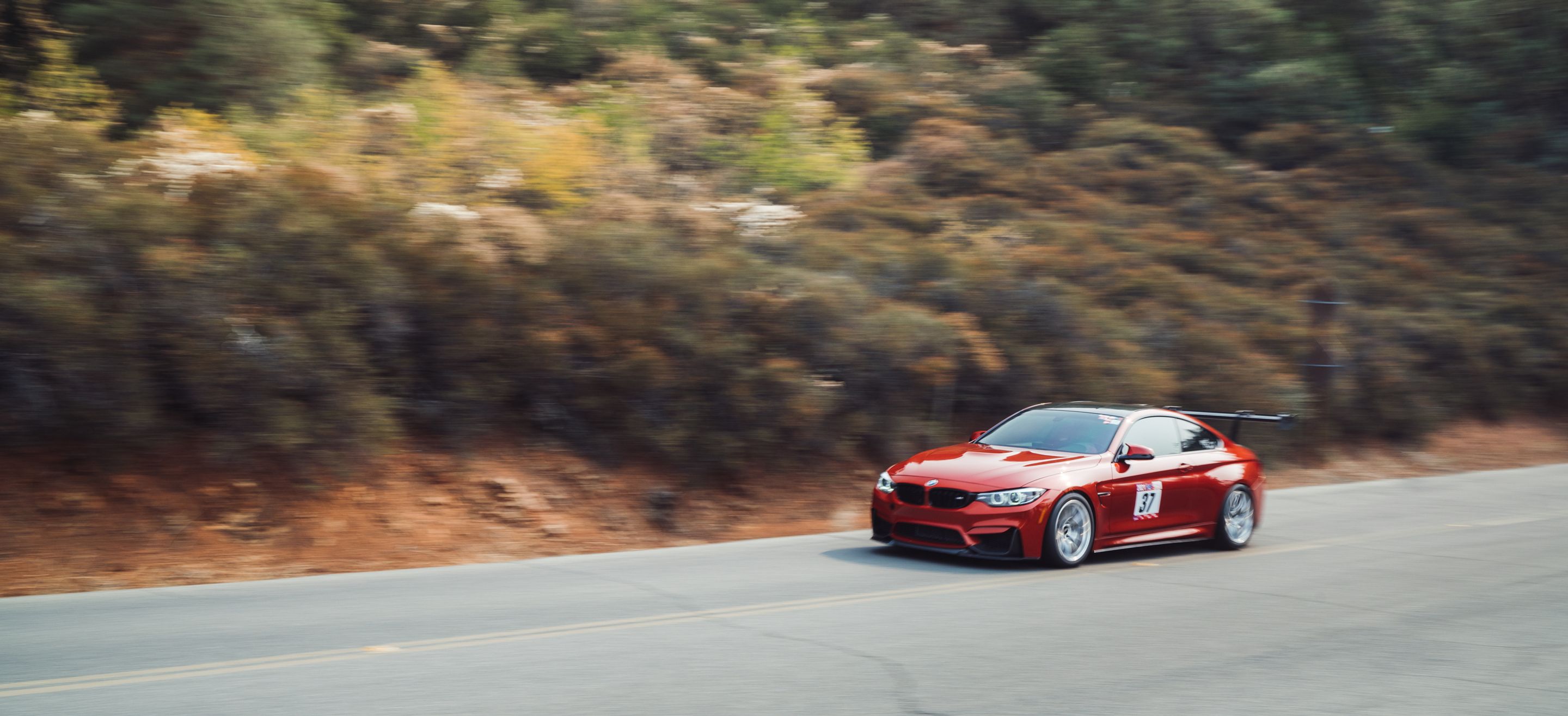 Orange BMW F82 Coupe M4 with 18" VS-5RS Apex wheels in Brushed Clear