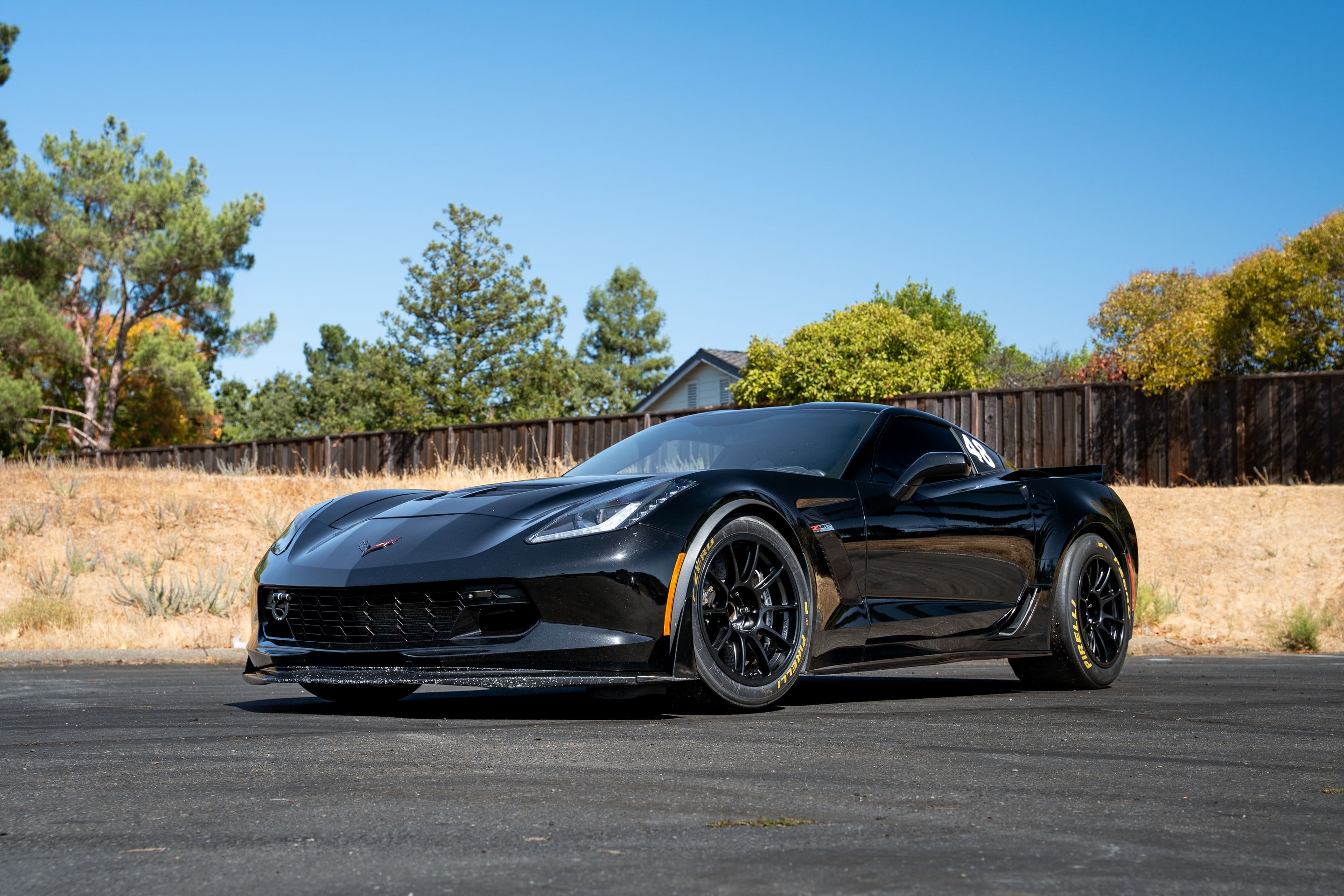 Black Chevrolet C7 Corvette Z06 with 18" SM-10RE Apex wheels in Satin Black