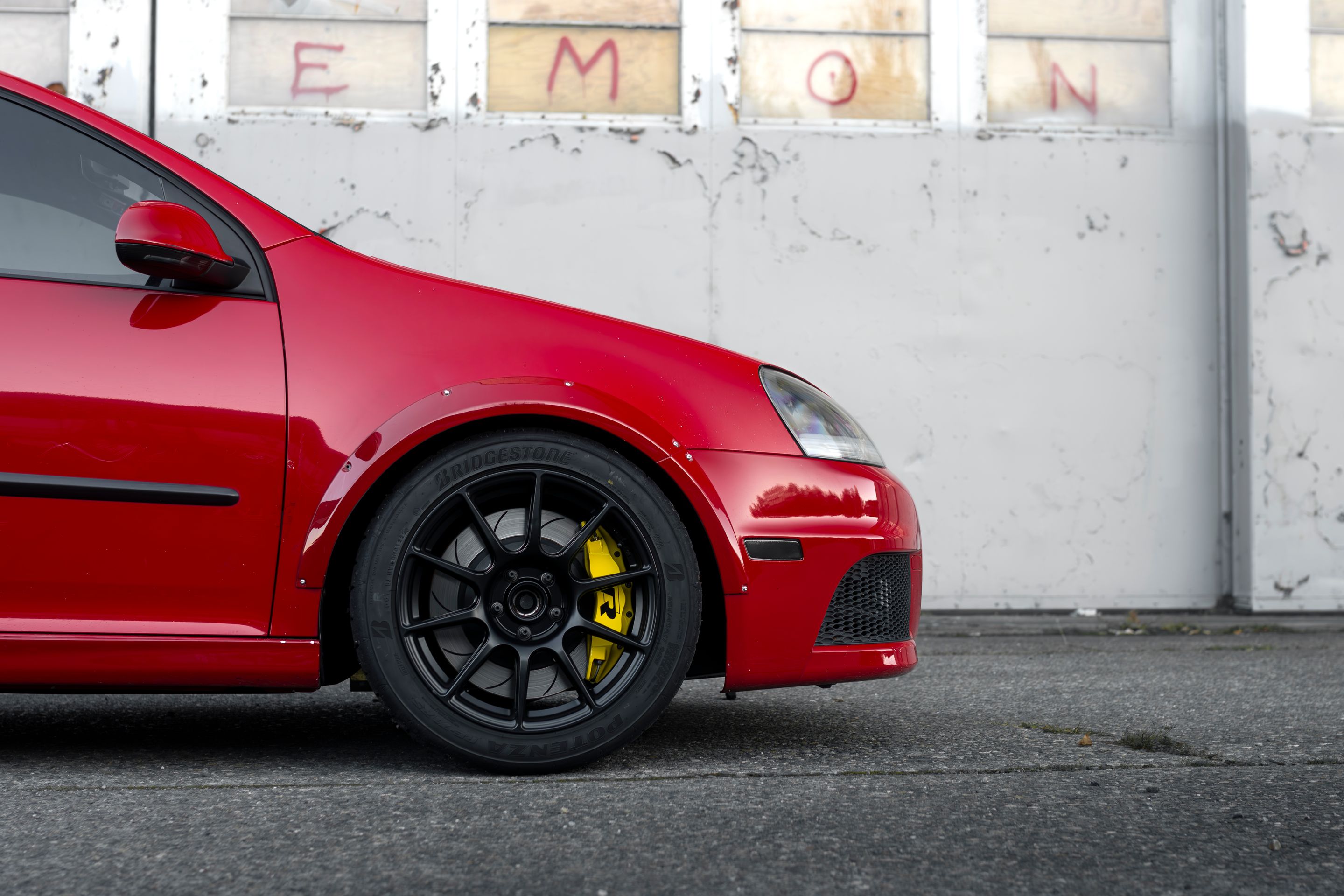 Red VW MK5 Golf with 17" SM-10 Apex wheels in Satin Black