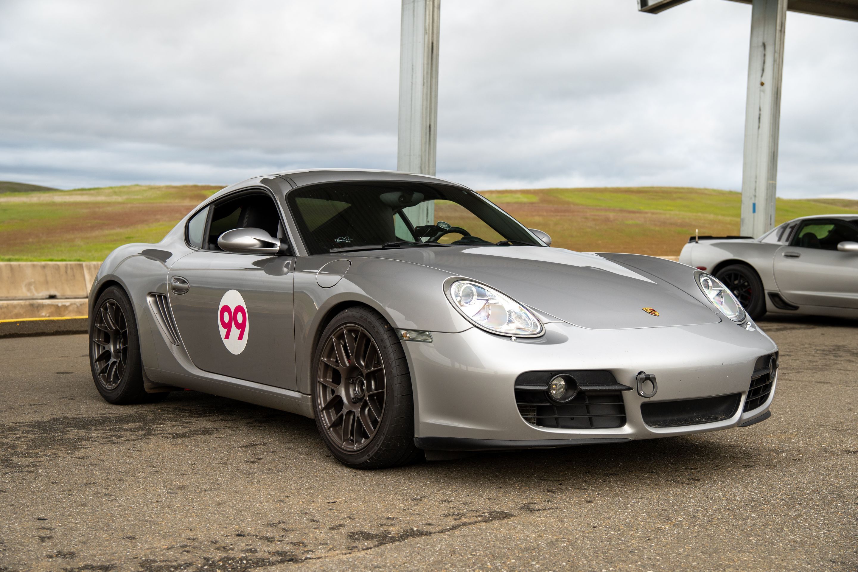 Silver Porsche 987 Cayman S with 18" EC-7RS Apex wheels in Anthracite