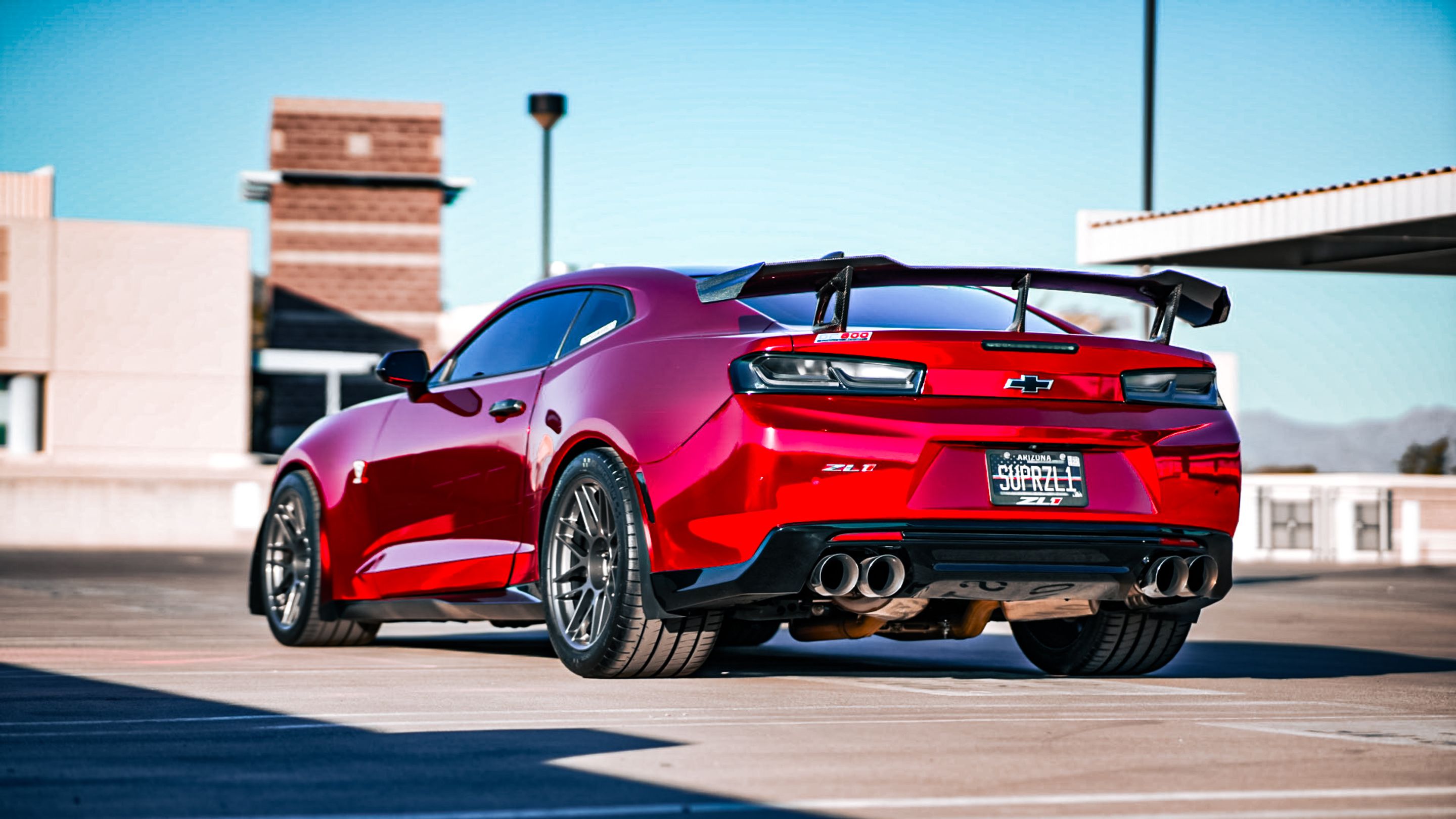 Red Chevrolet 6th Gen Camaro ZL1 with 19" ARC-8 Apex wheels in Anthracite