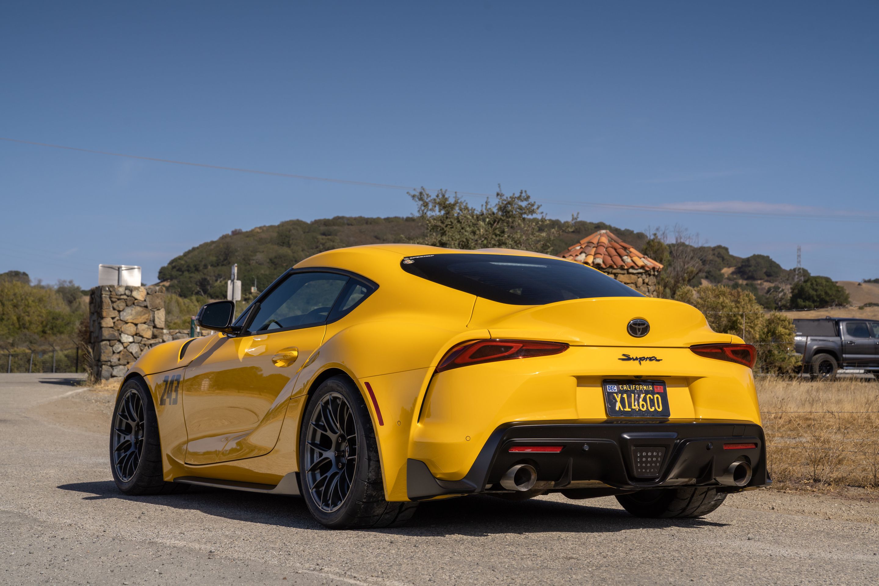 Yellow Toyota GR Supra with 18" EC-7RS Apex wheels in Anthracite