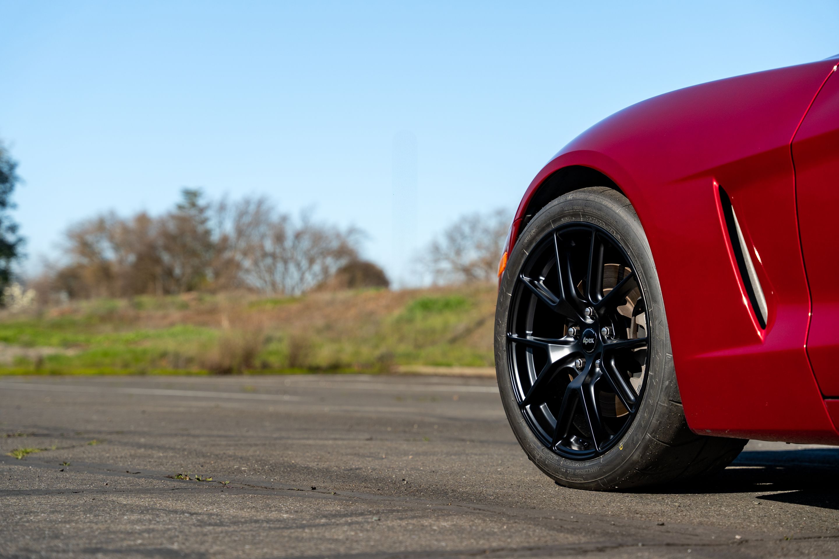 Red Chevrolet C6 Corvette Base/Z51 with 18" VS-5 Apex wheels in Satin Black