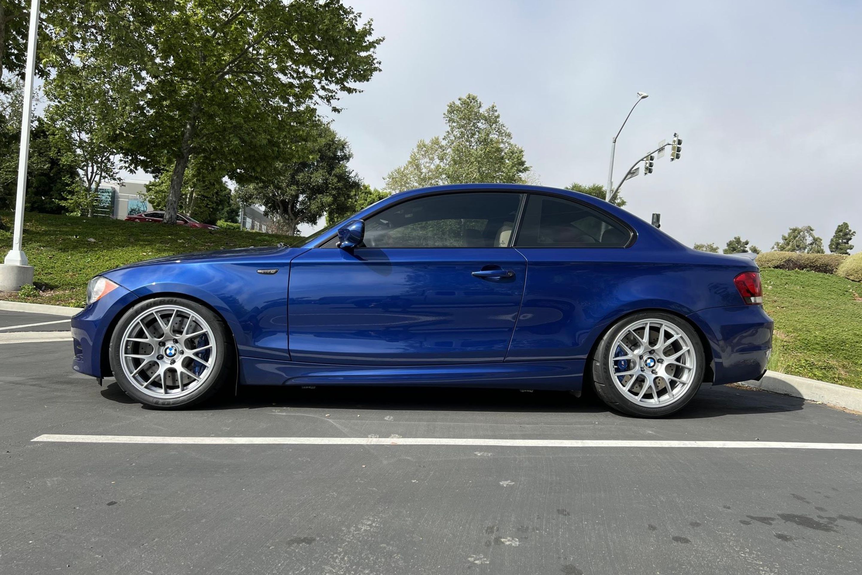 Blue BMW E82 Coupe 1 Series with 18" EC-7 Apex wheels in Race Silver