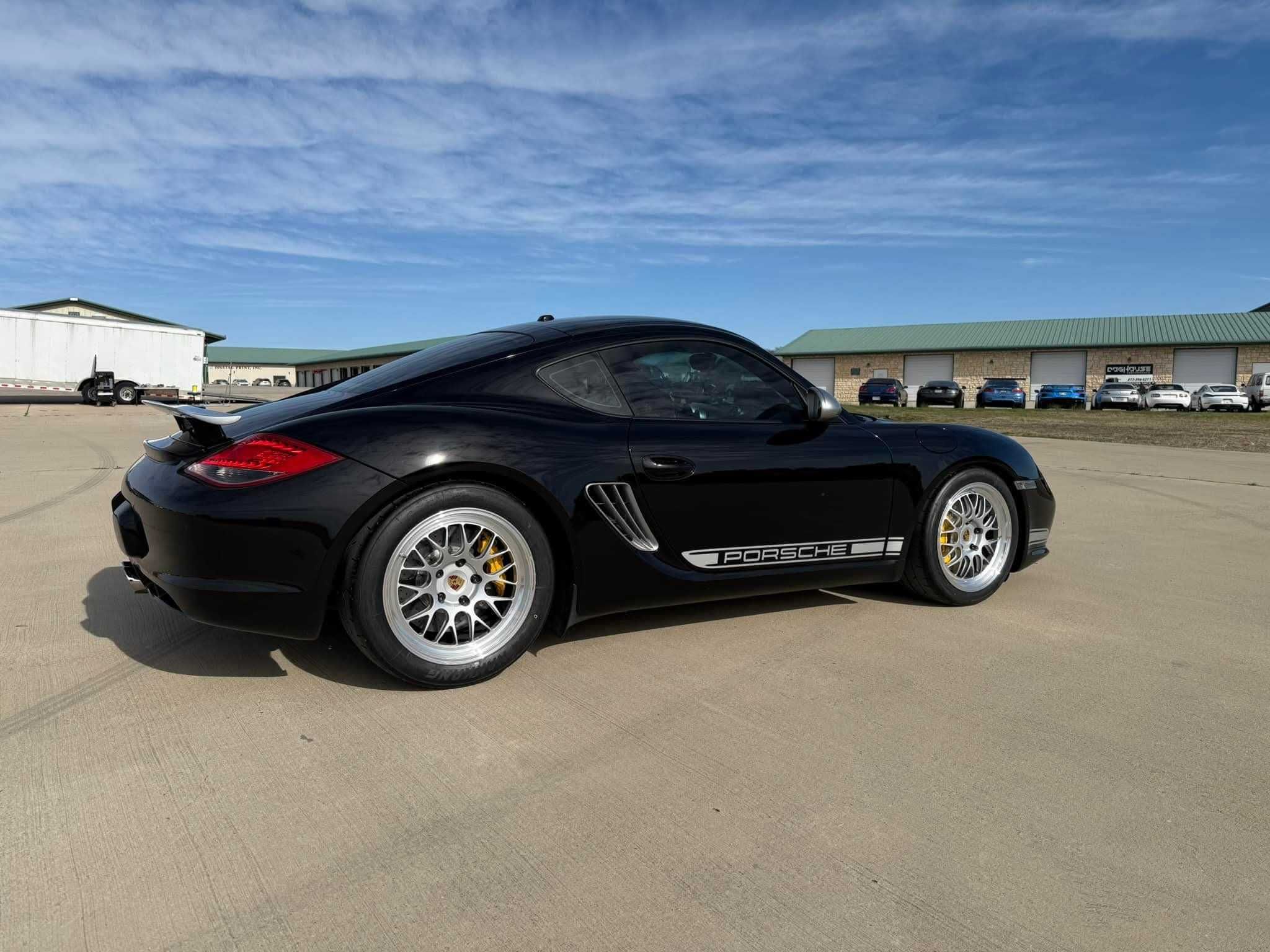 Black Porsche 987 Cayman R with 18" ML-10RT Apex wheels in Machined Lip Race Silver