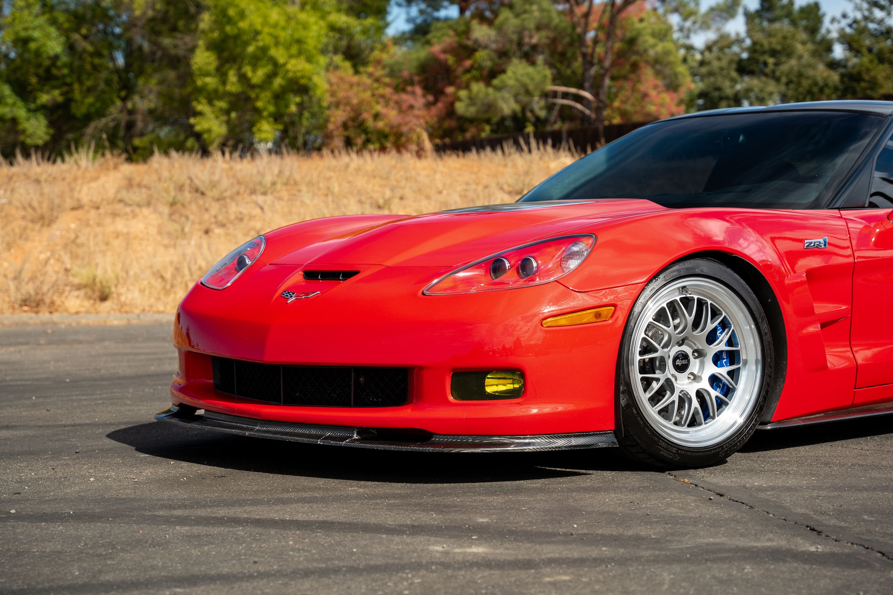 Red Chevrolet C6 Corvette ZR-1 with 18"/19" ML-10RT Apex wheels in Machined Lip Race Silver