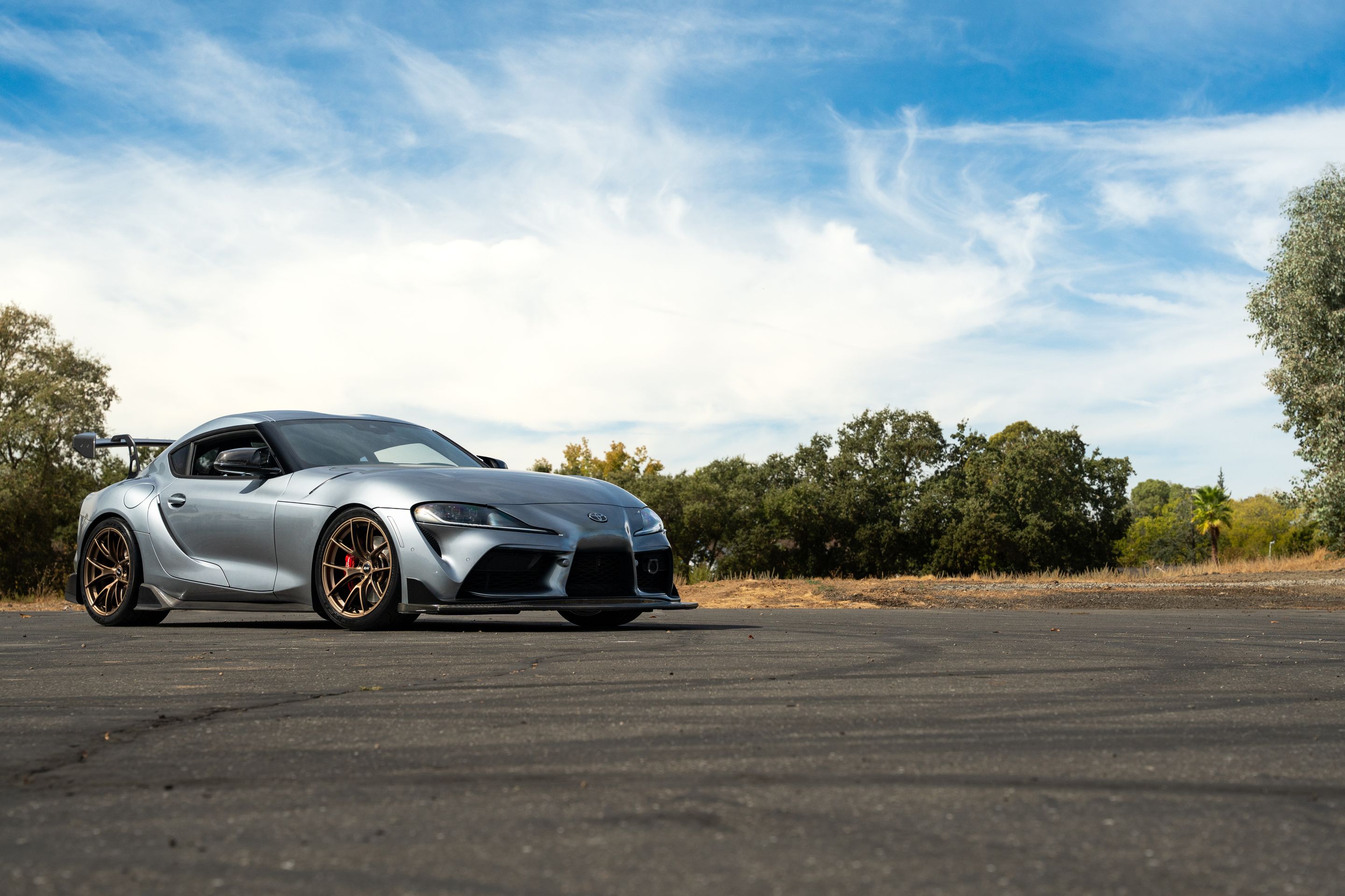 Grey Toyota GR Supra with 19" VS-5RS Apex wheels in Satin Bronze