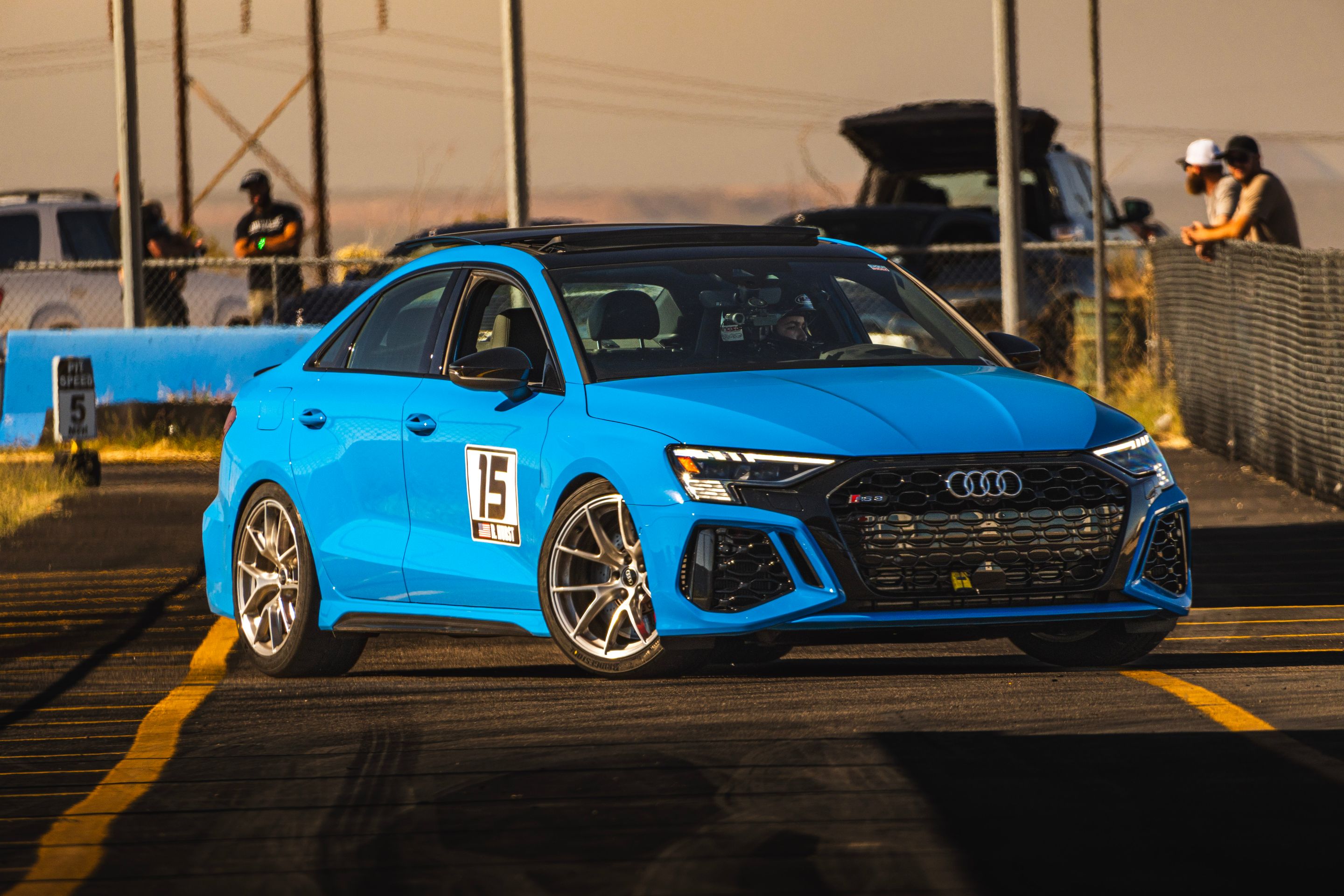 Blue Audi 8Y RS 3 with 18" VS-5RS Apex wheels in Brushed Clear