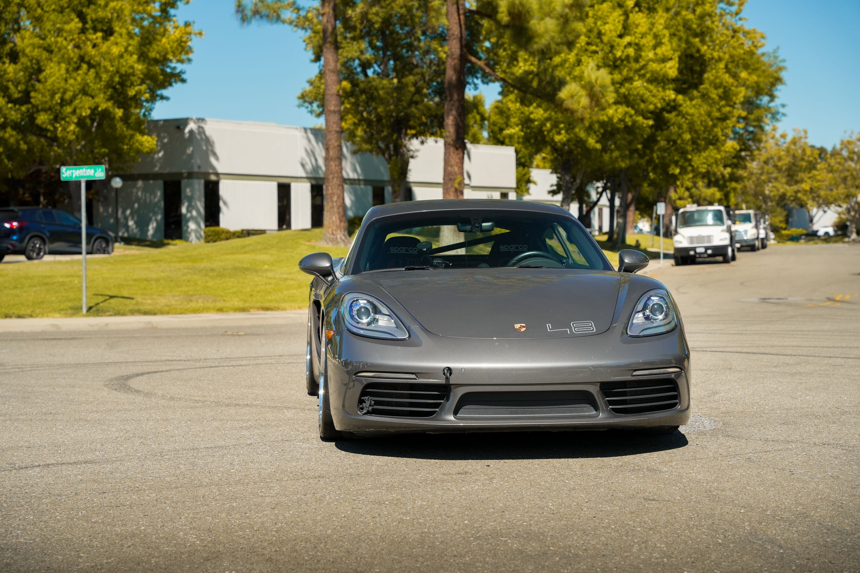 Grey Porsche 718 Cayman S with 18" ML-10RT Apex wheels in Machined Lip Gloss Motorsport Gold