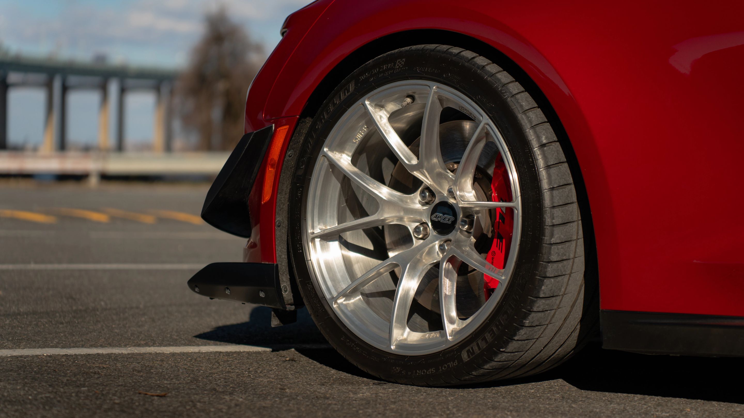 Red Chevrolet 6th Gen Camaro ZL1 with 19" VS-5RS Apex wheels in Brushed Clear