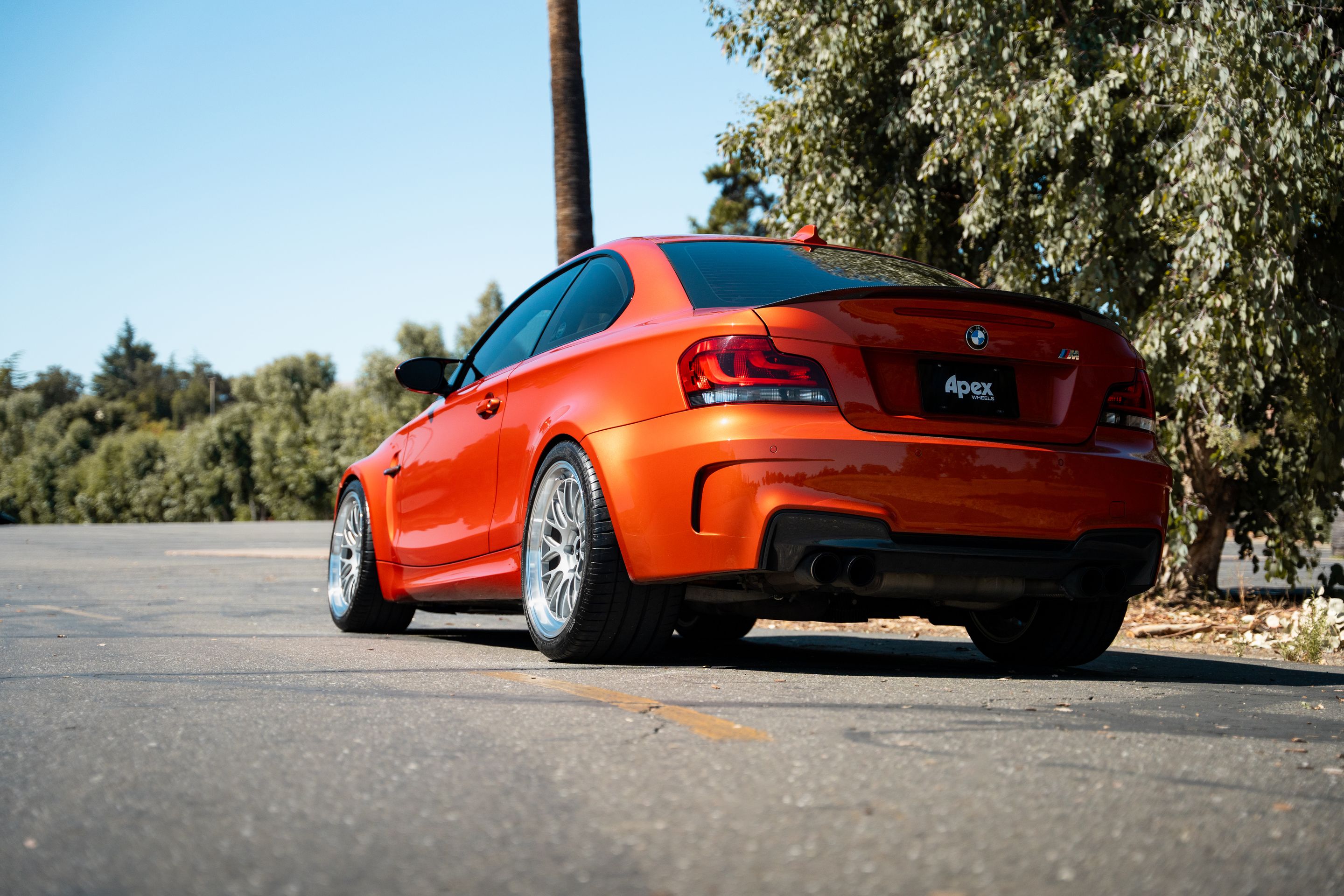 Orange BMW E82 1M with 19" ML-10RT Apex wheels in Machined Lip Race Silver