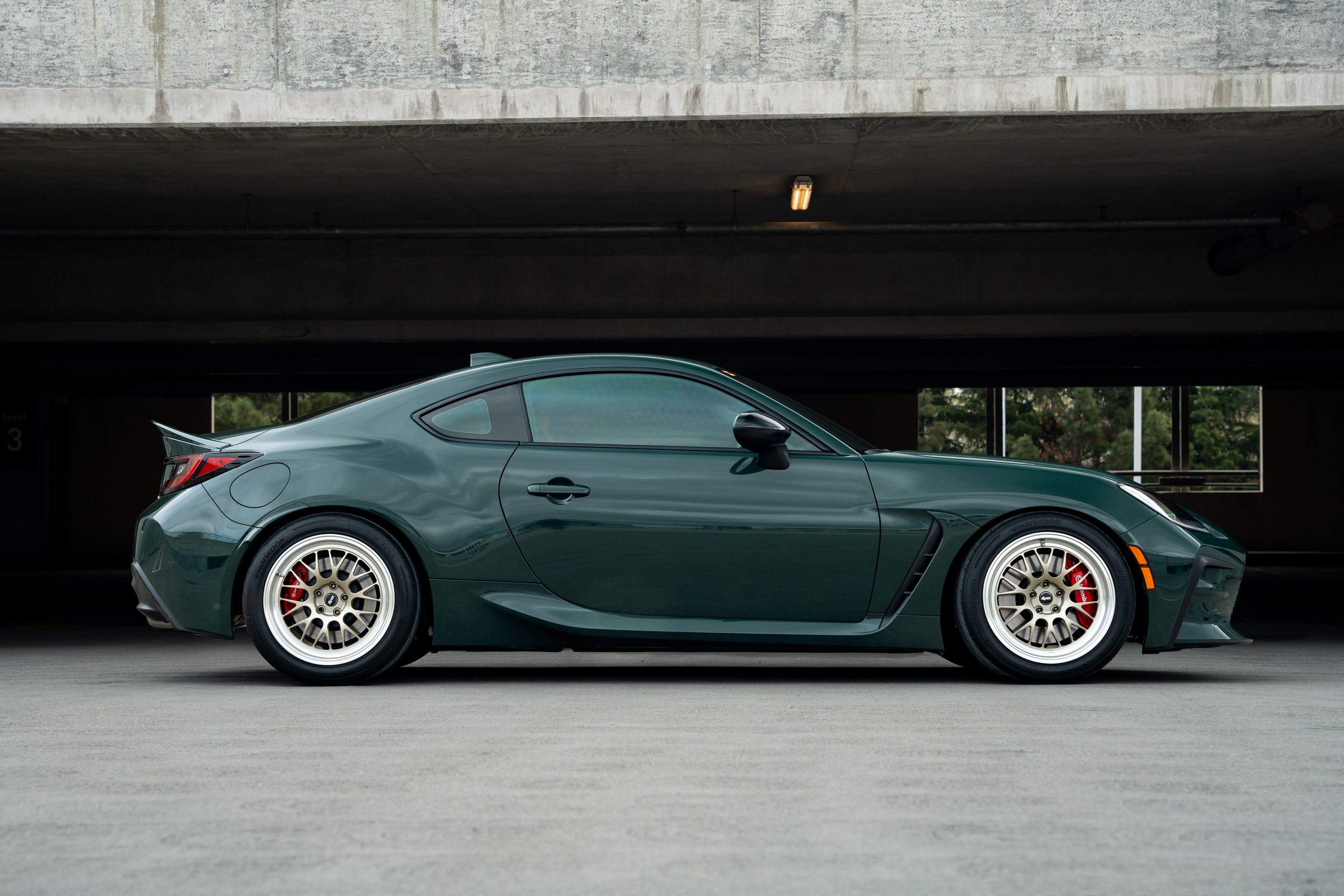 Green Toyota GR86 with 17" ML-10RT Apex wheels in Machined Lip Gloss Motorsport Gold