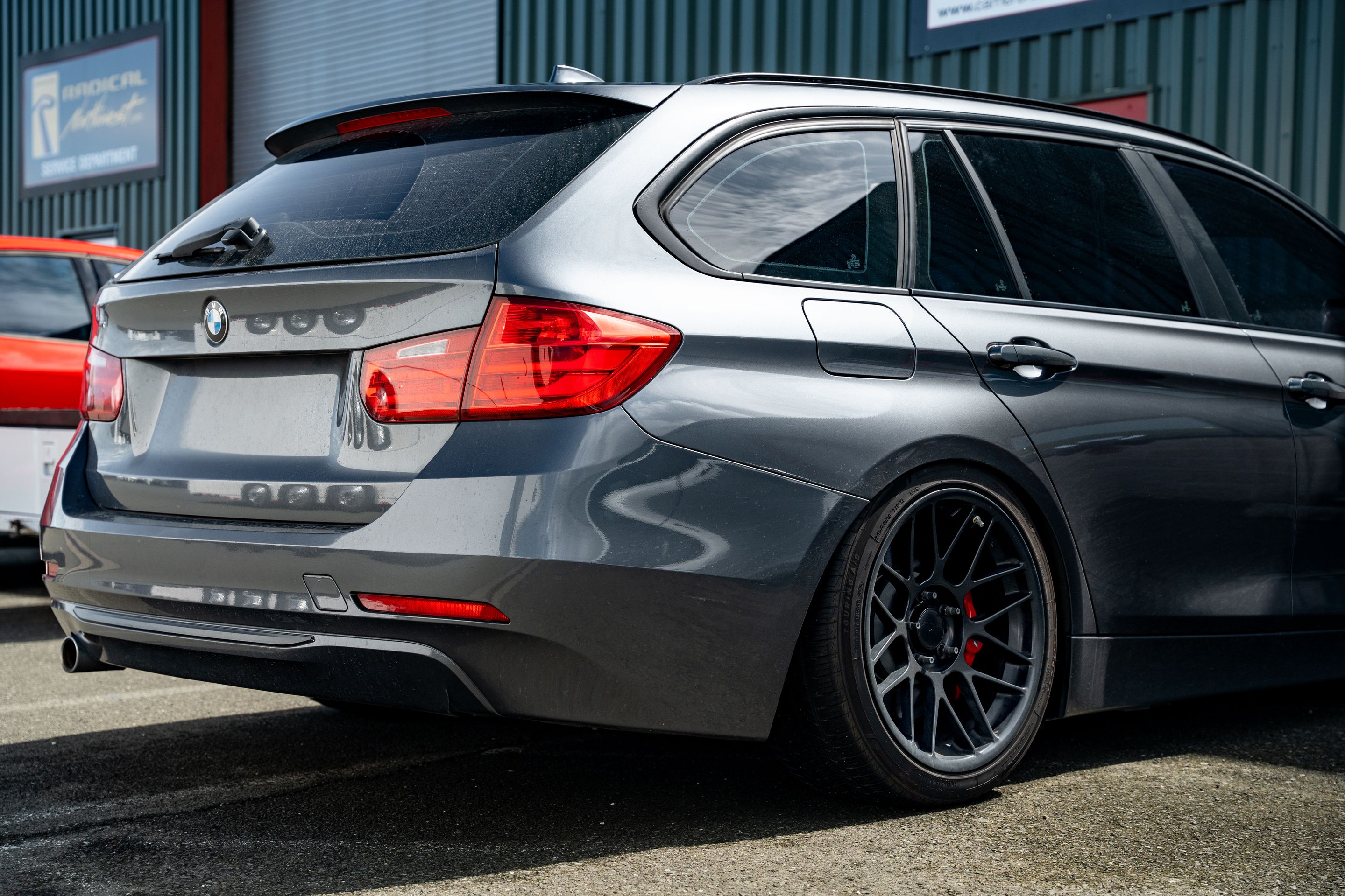 Grey BMW F31 Wagon 3 Series with 18" ARC-8 Apex wheels in Satin Black