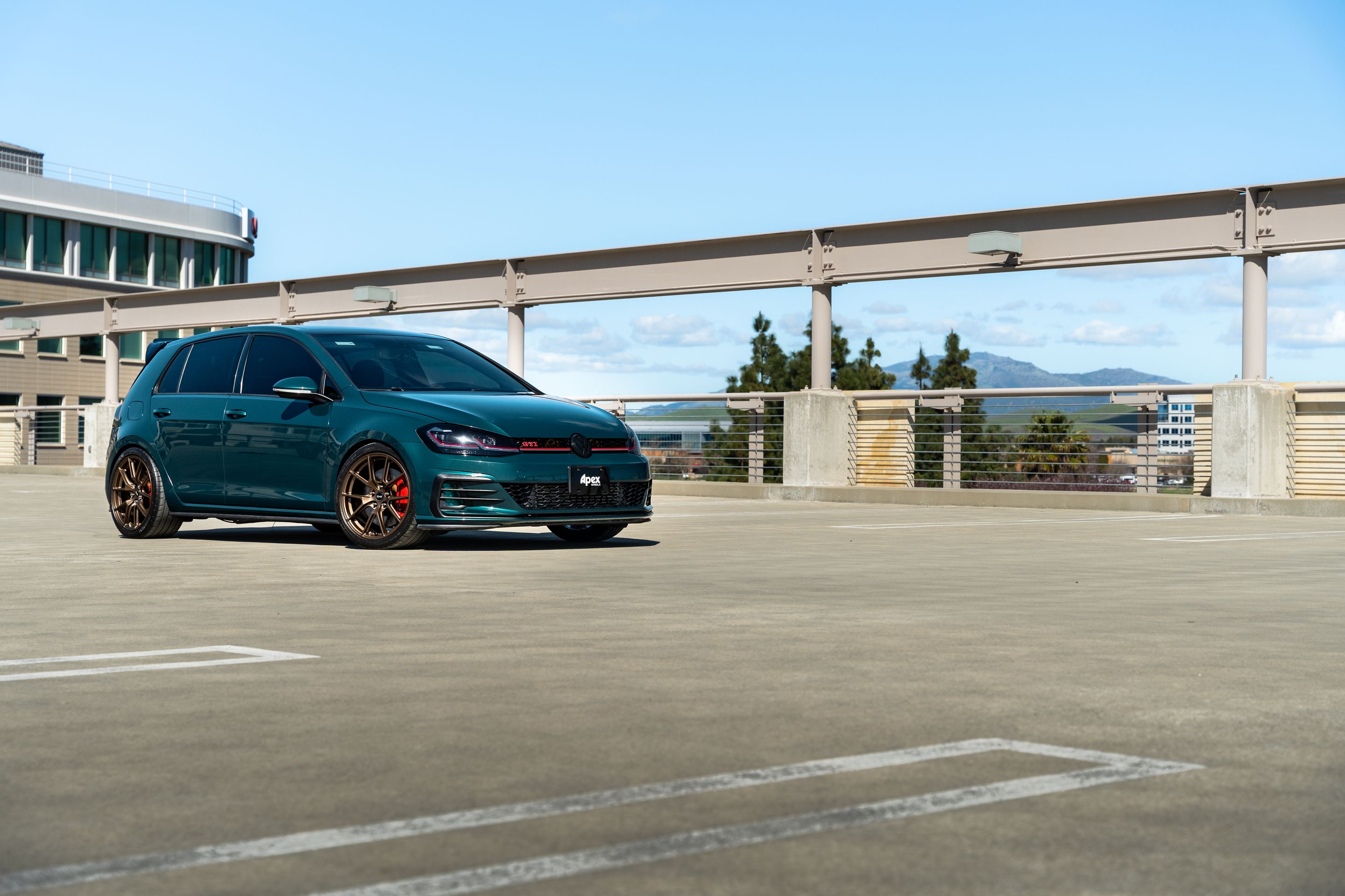 Green VW MK7 GTI with 18" VS-5 Apex wheels in Satin Bronze