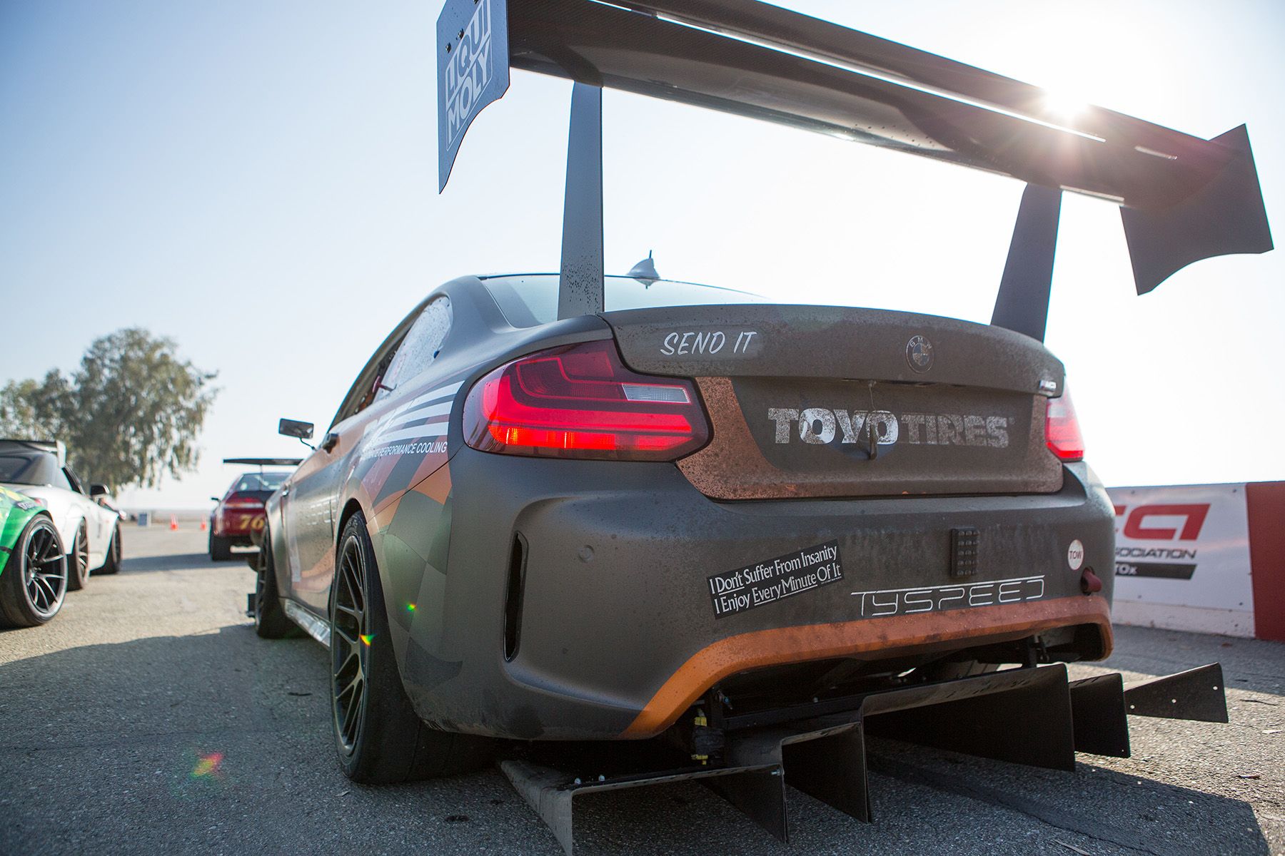 Multicolor BMW F87 M2 with 18" ARC-8R Apex wheels in Satin Black