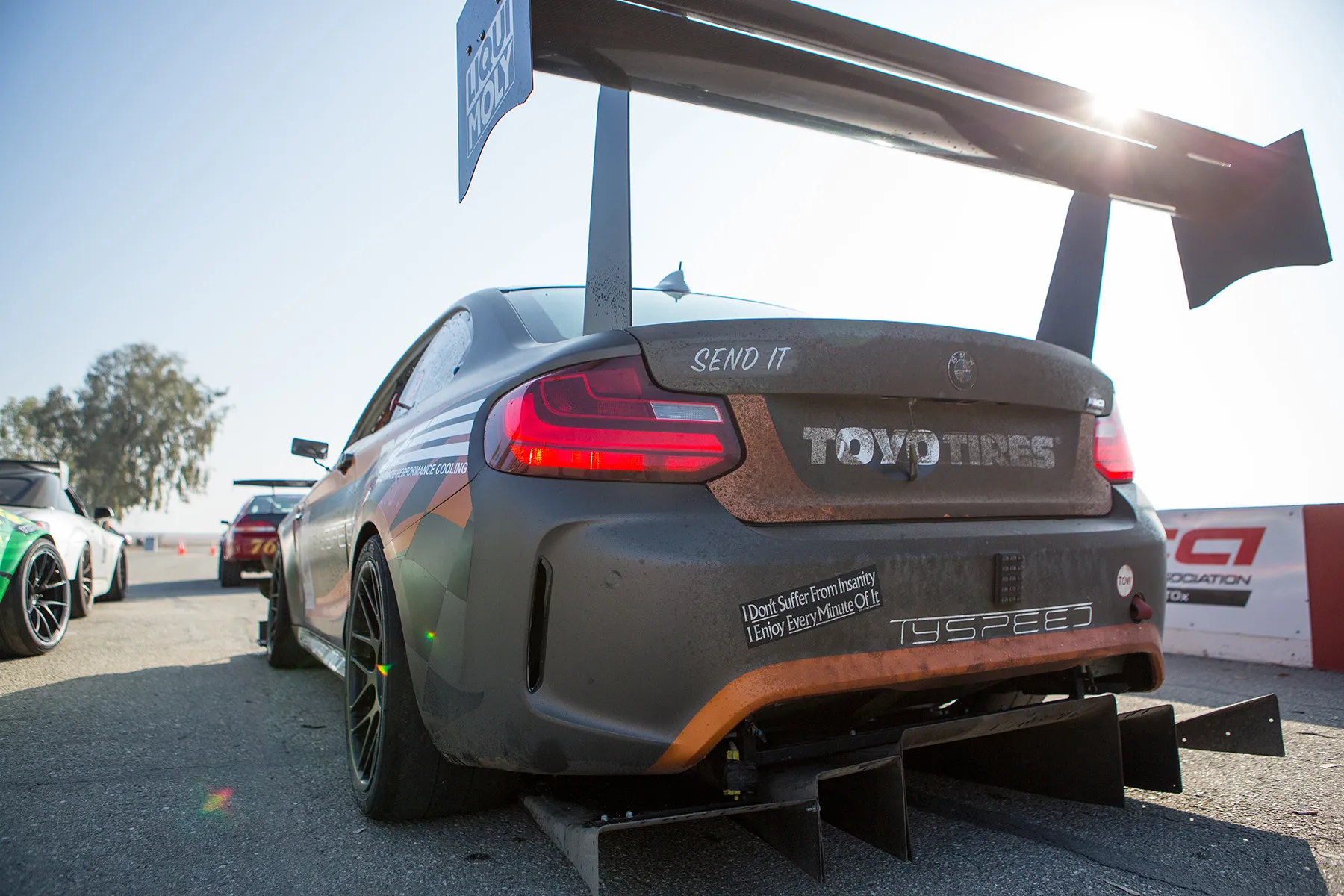 Multicolor BMW F87 M2 with 18" ARC-8R Apex wheels in Satin Black