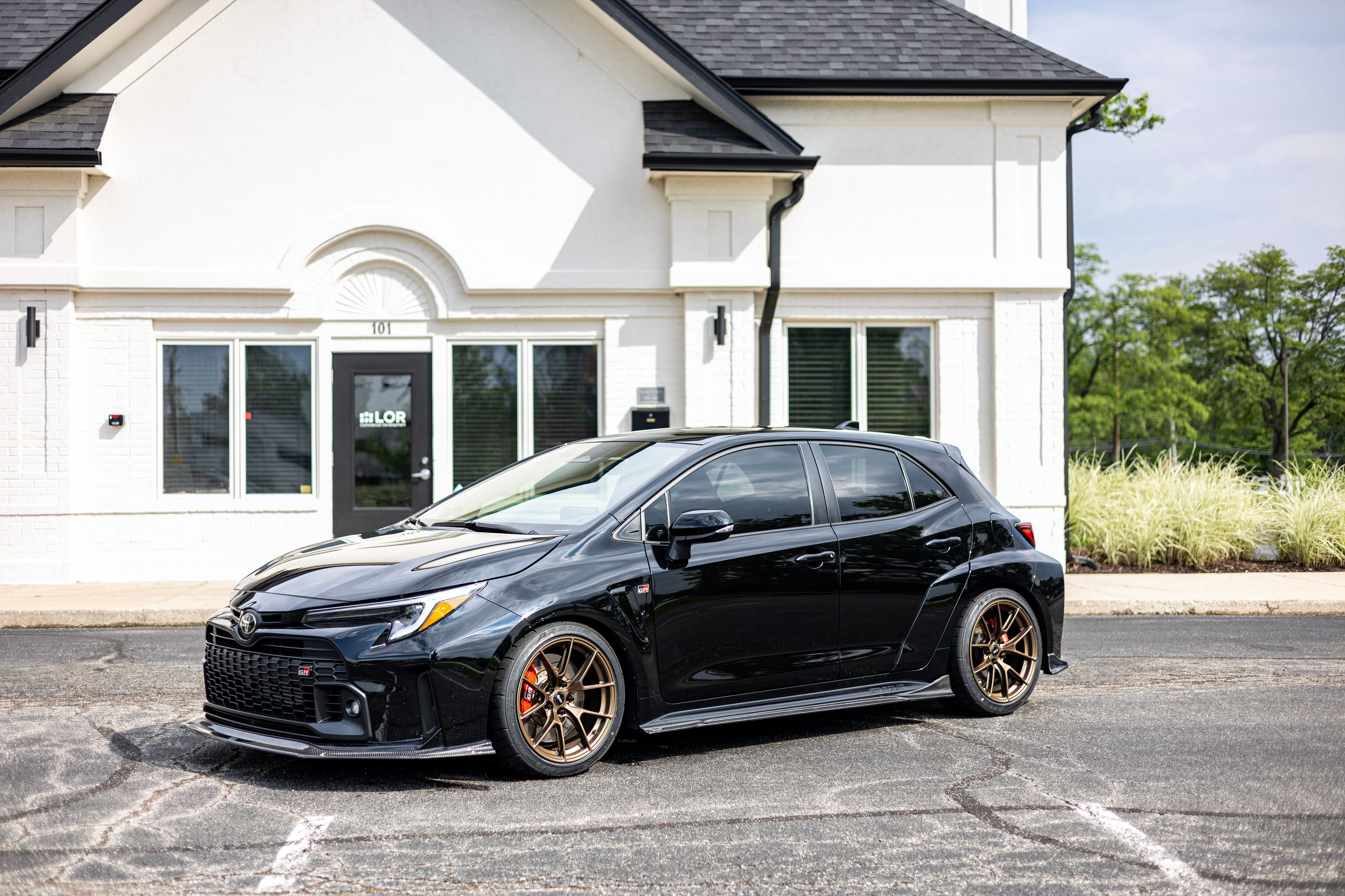 Black Toyota GR Corolla with 18" VS-5RS Apex wheels in Satin Bronze