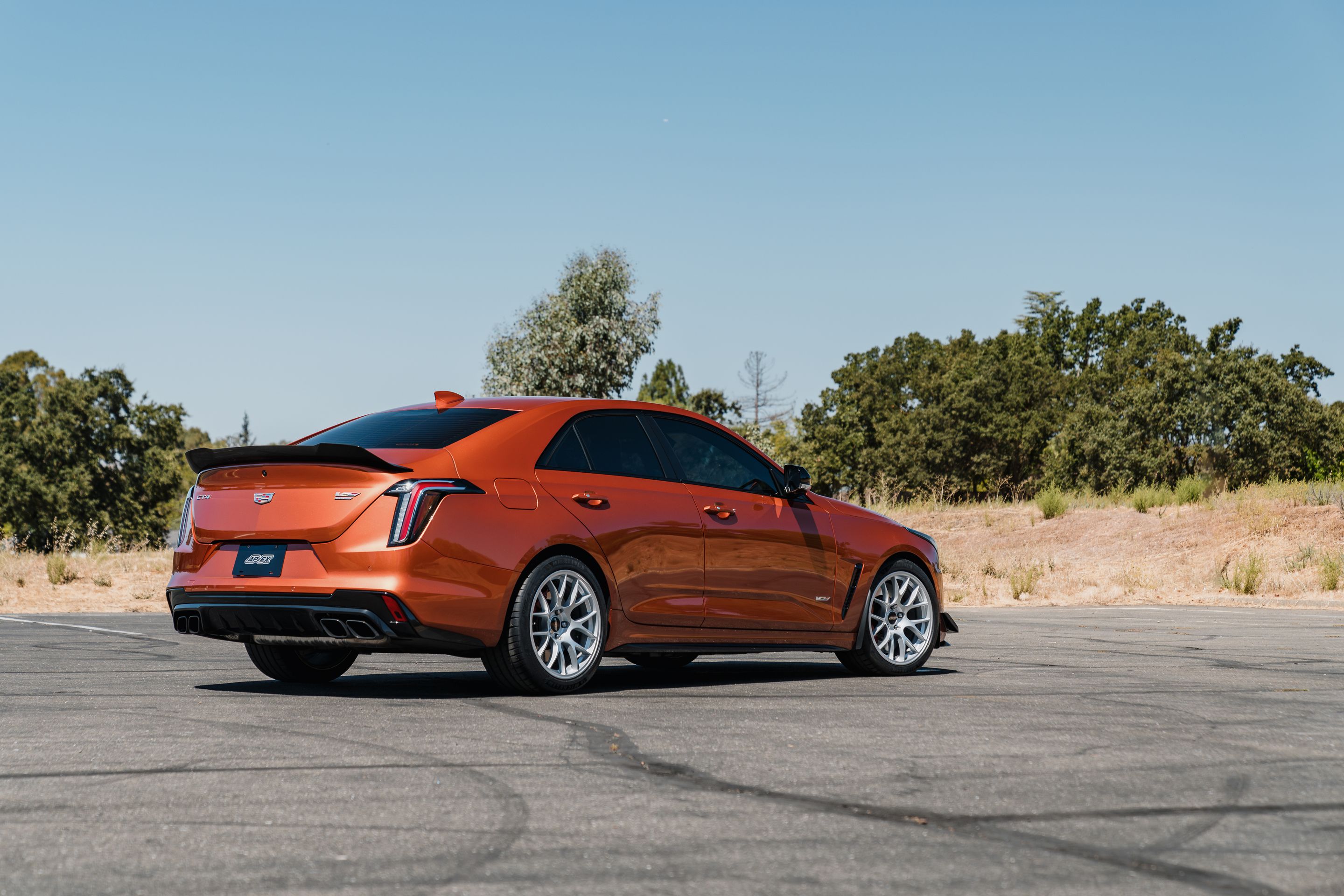 Orange Cadillac CT4-V Blackwing with 18" EC-7 Apex wheels in Race Silver