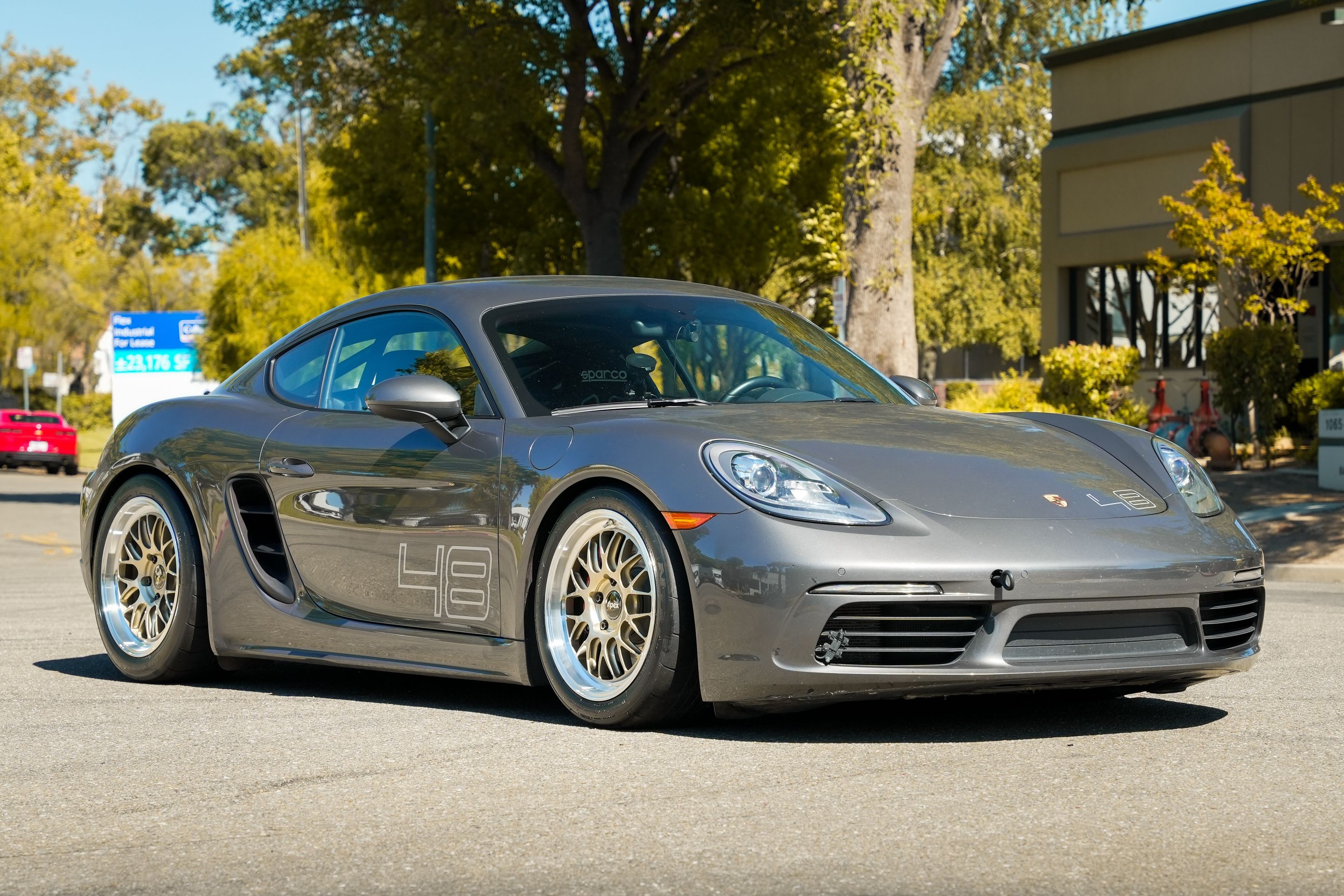 Grey Porsche 718 Cayman S with 18" ML-10RT Apex wheels in Machined Lip Gloss Motorsport Gold